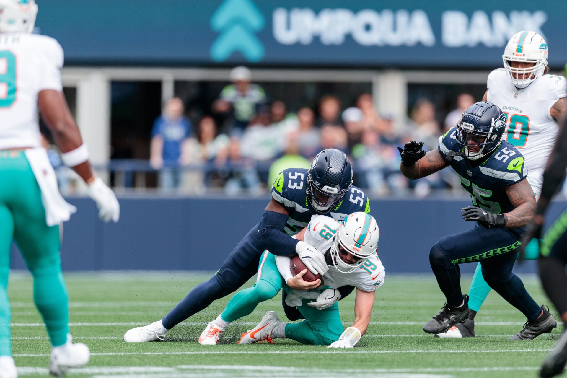 Seattle Seahawks linebacker Boye Mafe (53) sacks Miami Dolphins quarterback Skylar Thompson (19) during the second quarter at Lumen Field.