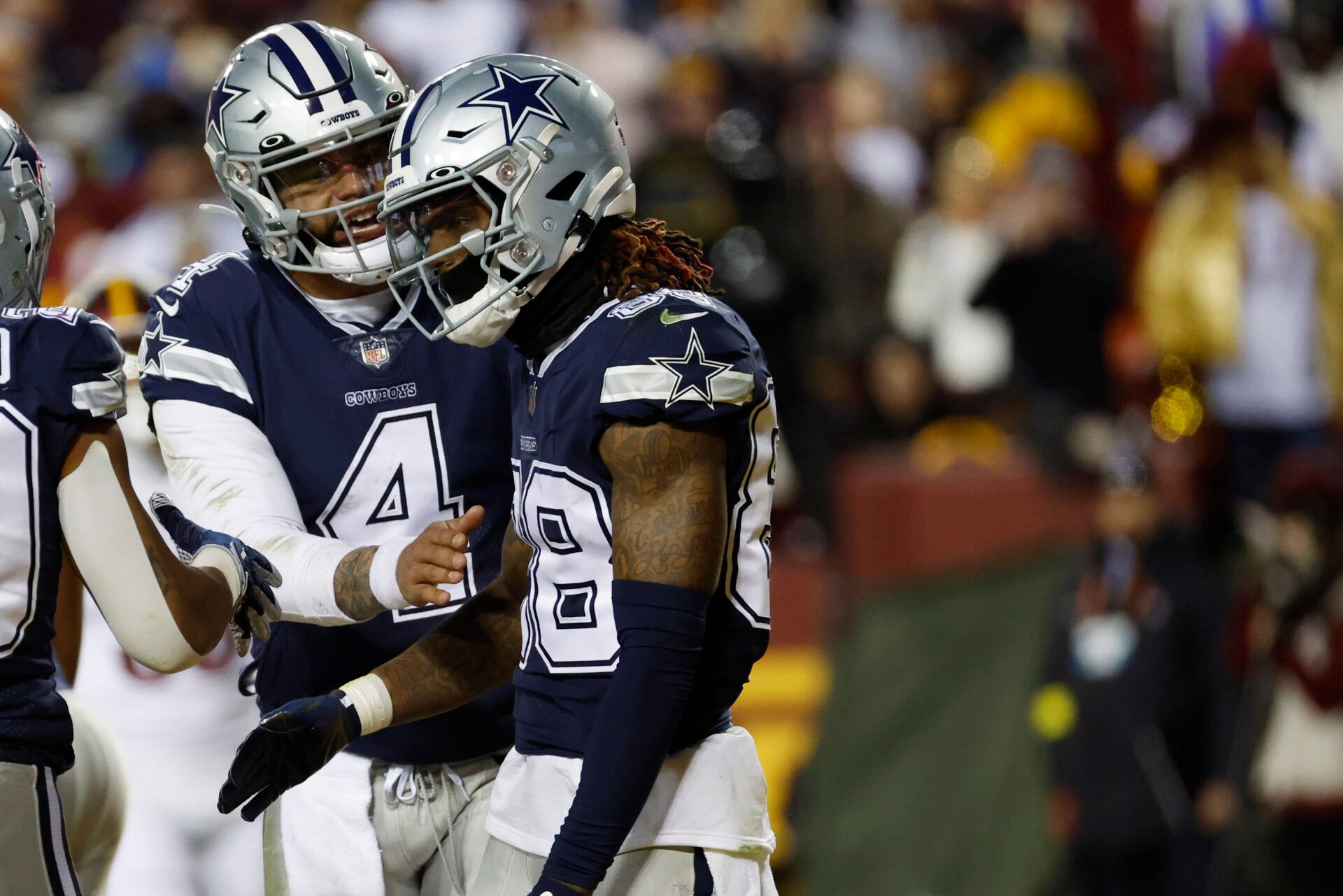 Jan 8, 2023; Landover, Maryland, USA; Dallas Cowboys quarterback Dak Prescott (4) celebrates with Cowboys wide receiver CeeDee Lamb (88) after connecting on a touchdown pass against the Washington Commanders during the second quarter at FedExField. Mandatory Credit: Geoff Burke-USA TODAY Sports