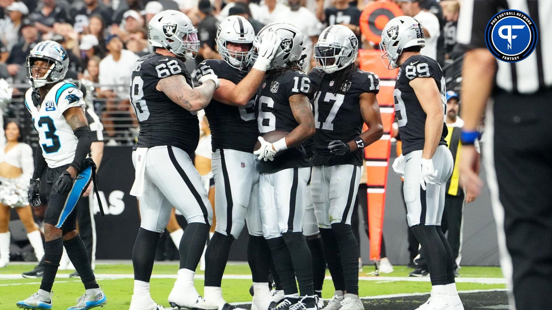 Sep 22, 2024; Paradise, Nevada, USA; Las Vegas Raiders wide receiver Jakobi Meyers (16) celebrates with team mates after scoring a touchdown against the Carolina Panthers during the fourth quarter at Allegiant Stadium. Mandatory Credit: Stephen R. Sylvanie-Imagn Images