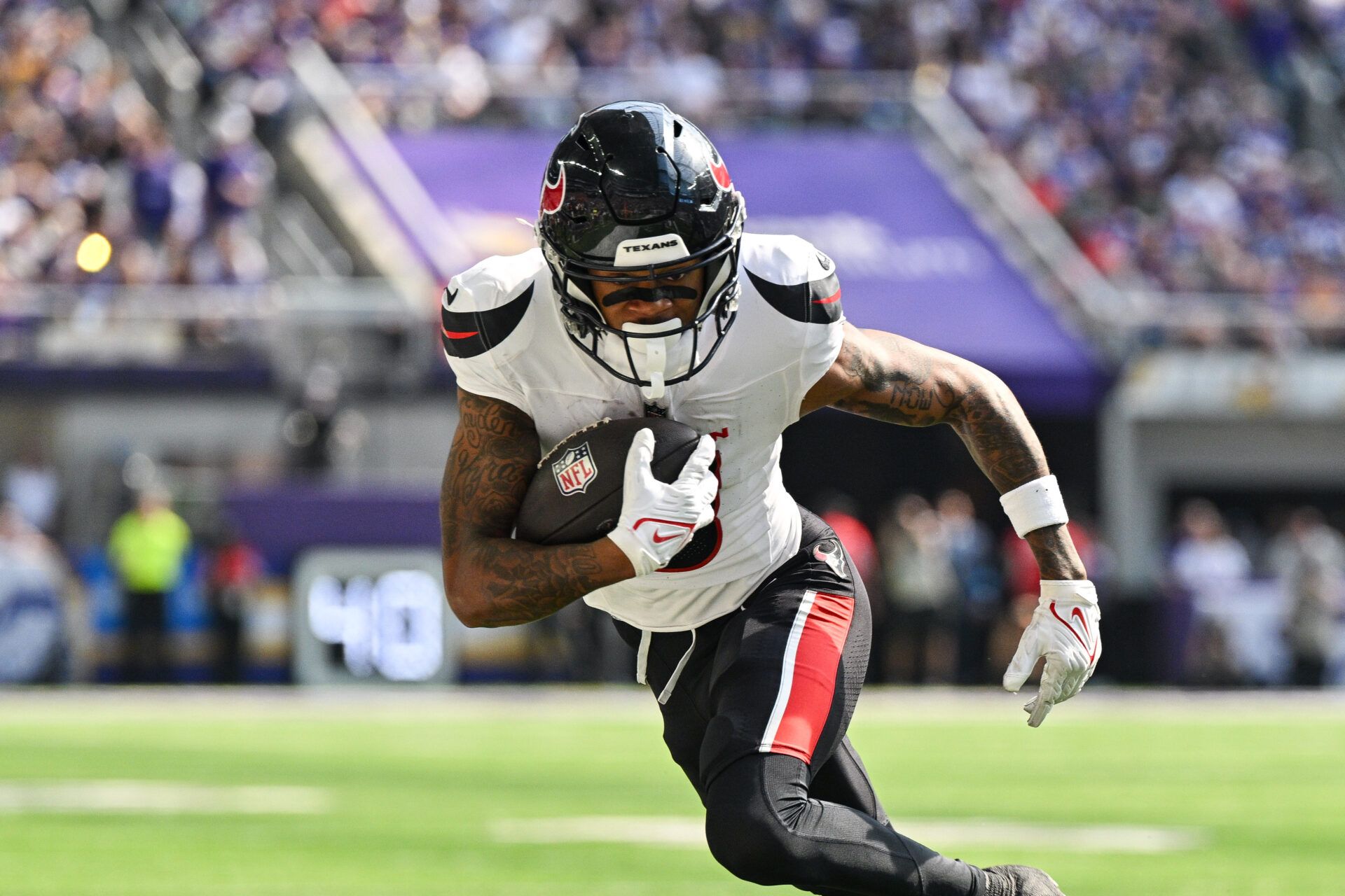 Sep 22, 2024; Minneapolis, Minnesota, USA; Houston Texans wide receiver Tank Dell (3) runs the ball against the Minnesota Vikings during the third quarter at U.S. Bank Stadium. Mandatory Credit: Jeffrey Becker-Imagn Images