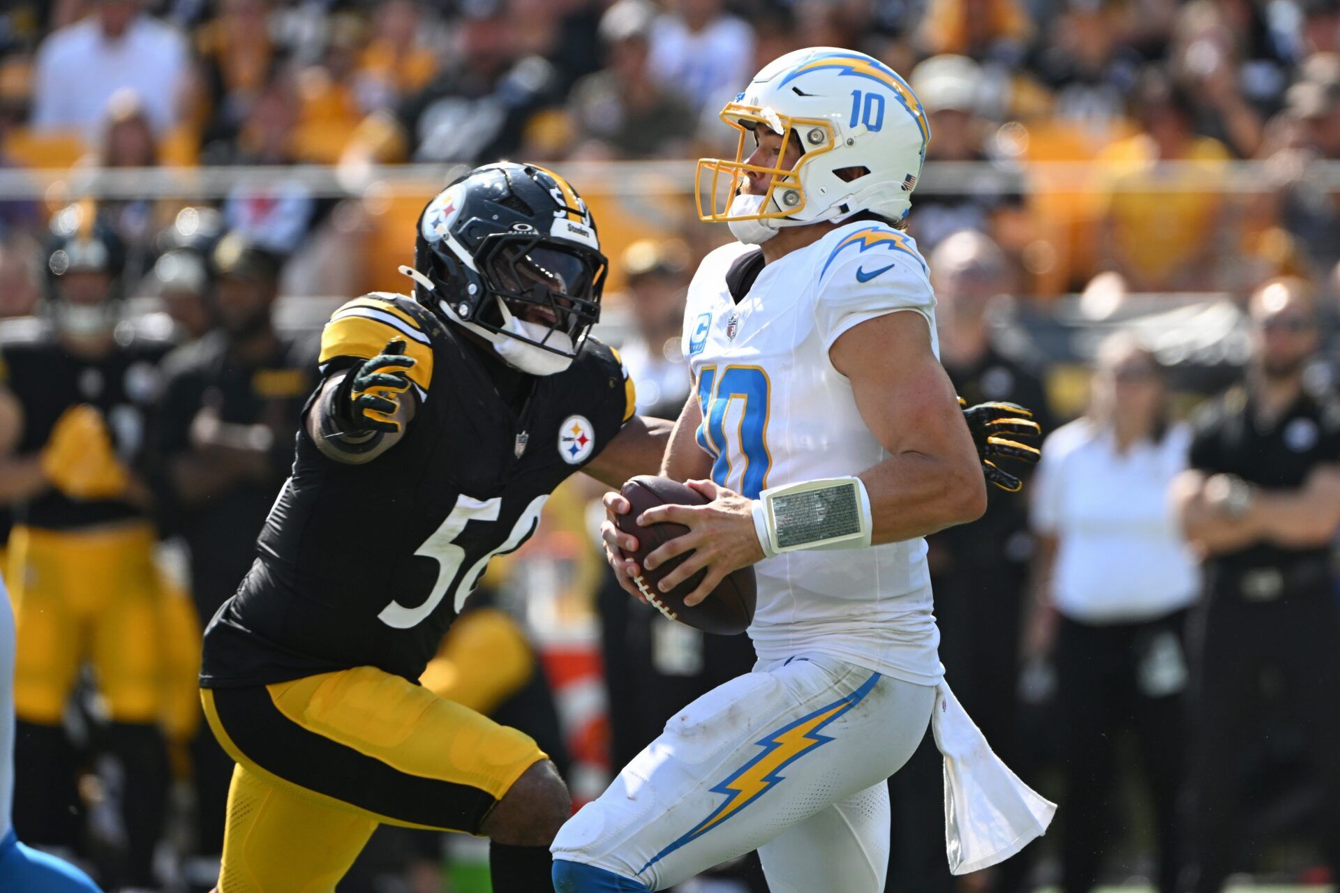 Sep 22, 2024; Pittsburgh, Pennsylvania, USA; Pittsburgh Steelers linebacker Elandon Roberts (50) sacks Los Angeles Chargers quarterback Justin Herbert (10) during the third quarter at Acrisure Stadium. Mandatory Credit: Barry Reeger-Imagn Images