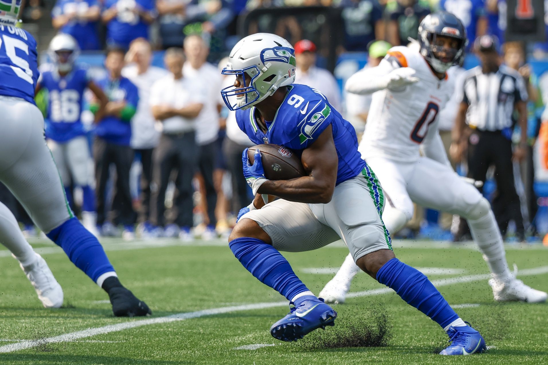 Seattle Seahawks running back Kenneth Walker III (9) rushes against the Denver Broncos during the first quarter at Lumen Field.