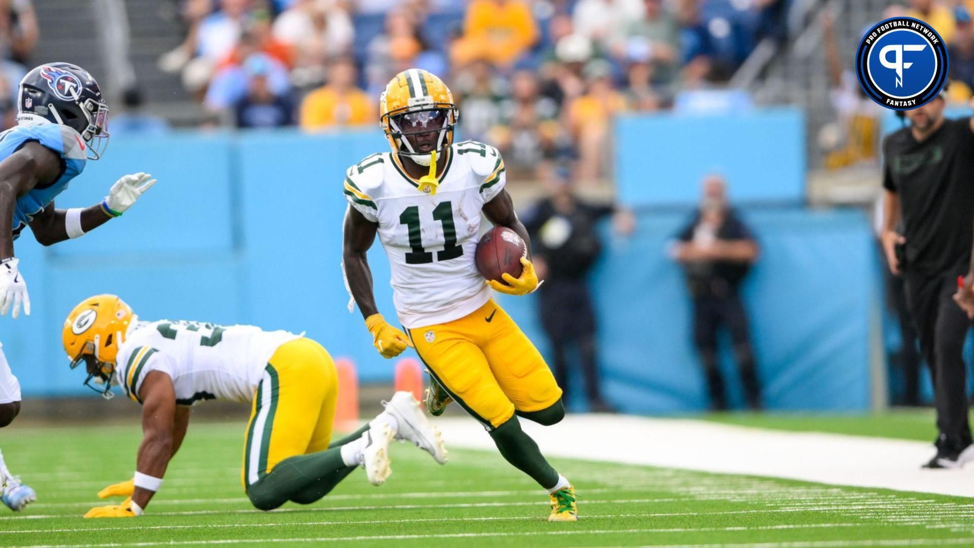 Sep 22, 2024; Nashville, Tennessee, USA; Green Bay Packers wide receiver Jayden Reed (11) runs the ball after.made catch against the Tennessee Titans during the first half at Nissan Stadium. Mandatory Credit: Steve Roberts-Imagn Images