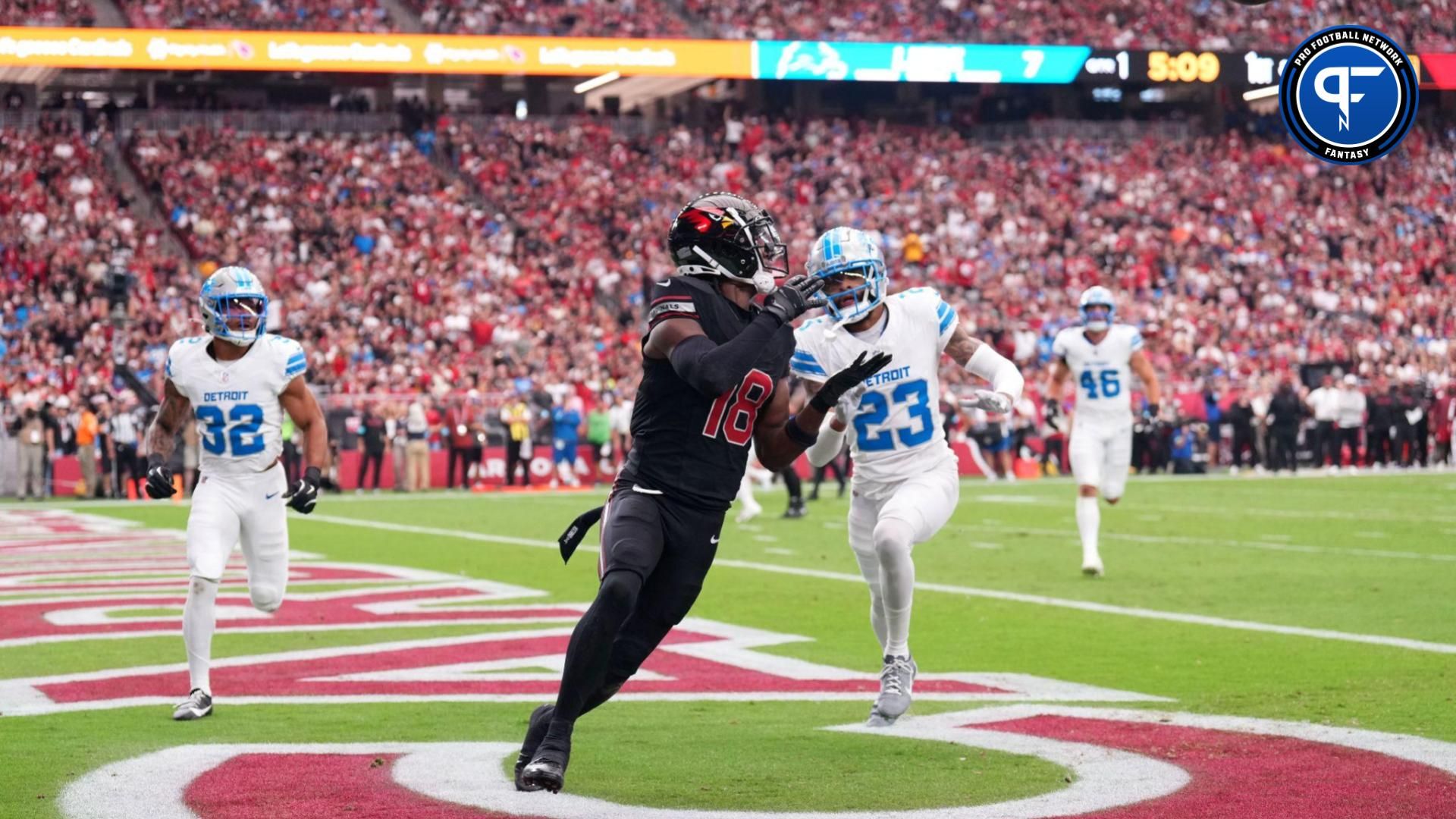 Arizona Cardinals wide receiver Marvin Harrison Jr. (18) catches a touchdown pass against the Detroit Lions during the first half at State Farm Stadium.