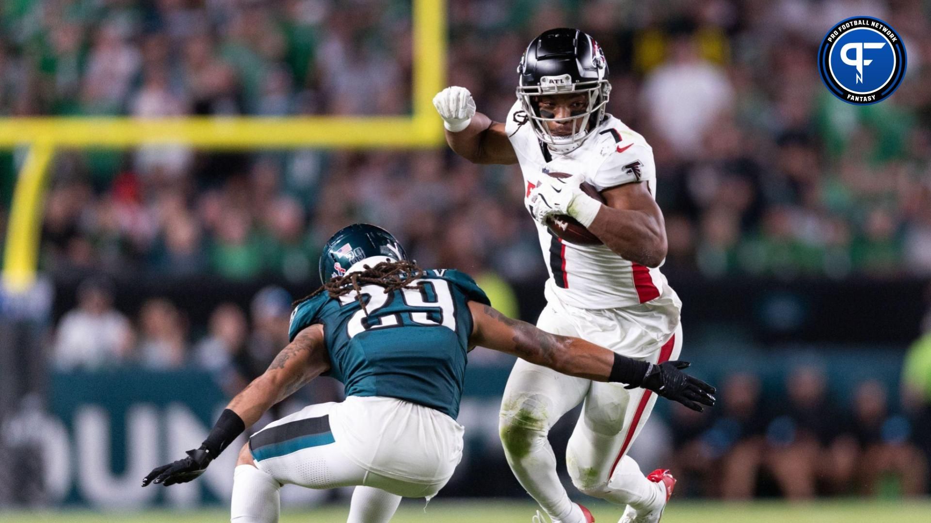 Sep 16, 2024; Philadelphia, Pennsylvania, USA; Atlanta Falcons running back Bijan Robinson (7) avoids the tackle of Philadelphia Eagles cornerback Avonte Maddox (29) during the second quarter at Lincoln Financial Field. Mandatory Credit: Bill Streicher-Imagn Images