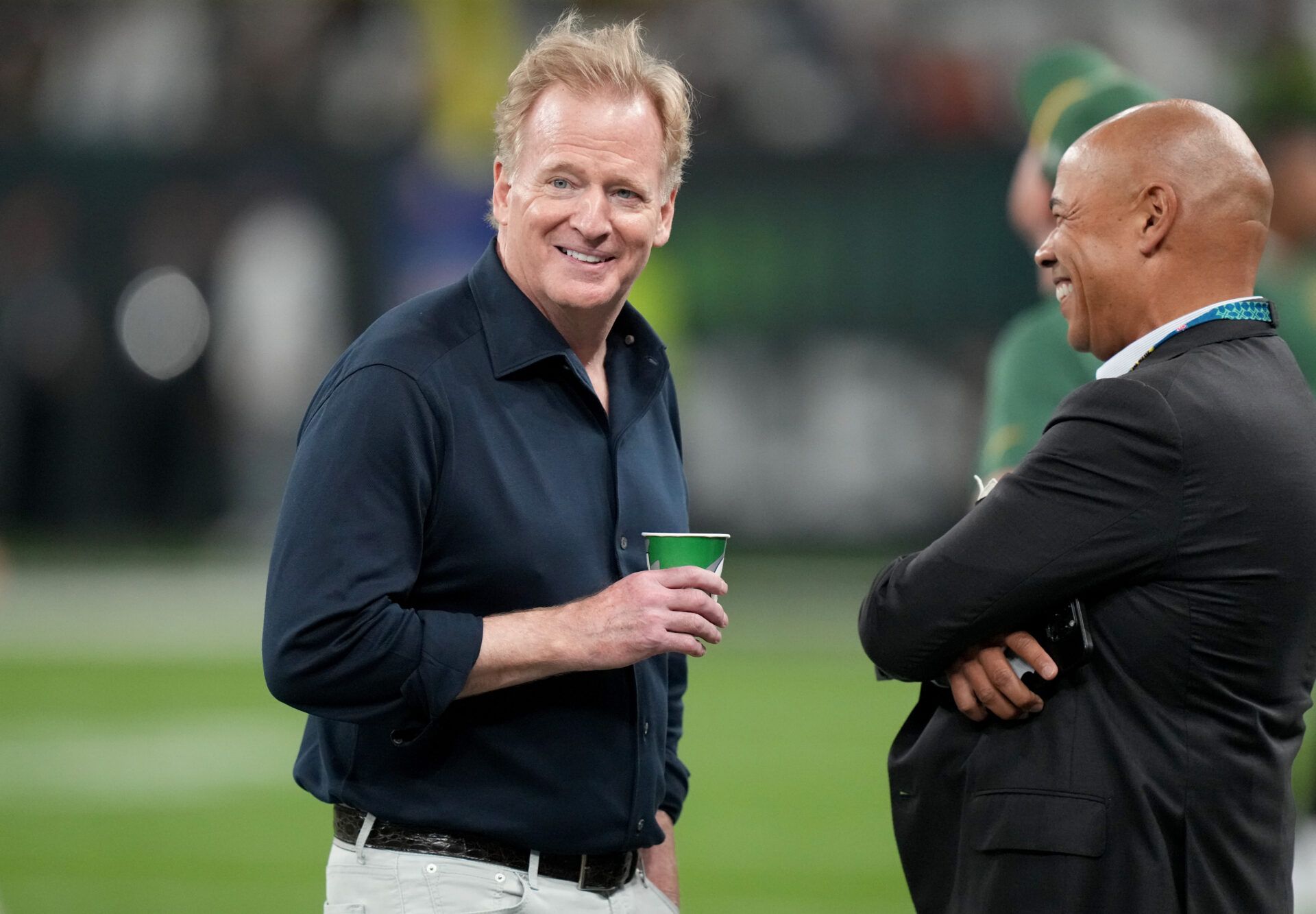 NFL commissioner Roger Goodell talks to NFL Players Association executive director  Lloyd Howell before a game in Brazil between the Green Bay Packers and Philadelphia Eagles at Neo Quimica Arena.