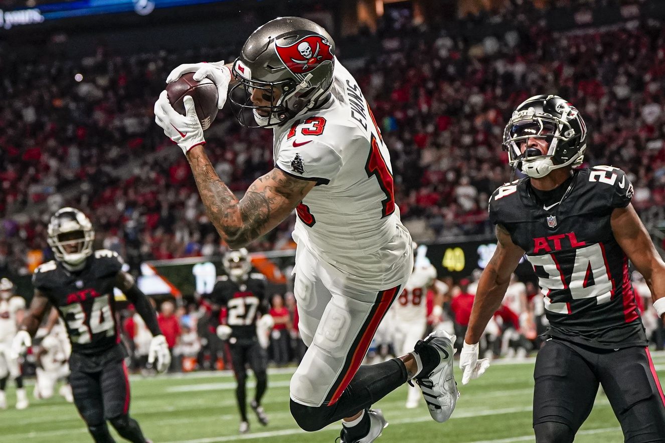 Tampa Bay Buccaneers wide receiver Mike Evans (13) makes a catch in the end zone behind Atlanta Falcons cornerback A.J. Terrell (24) but is ruled out of bounds during the second half at Mercedes-Benz Stadium.