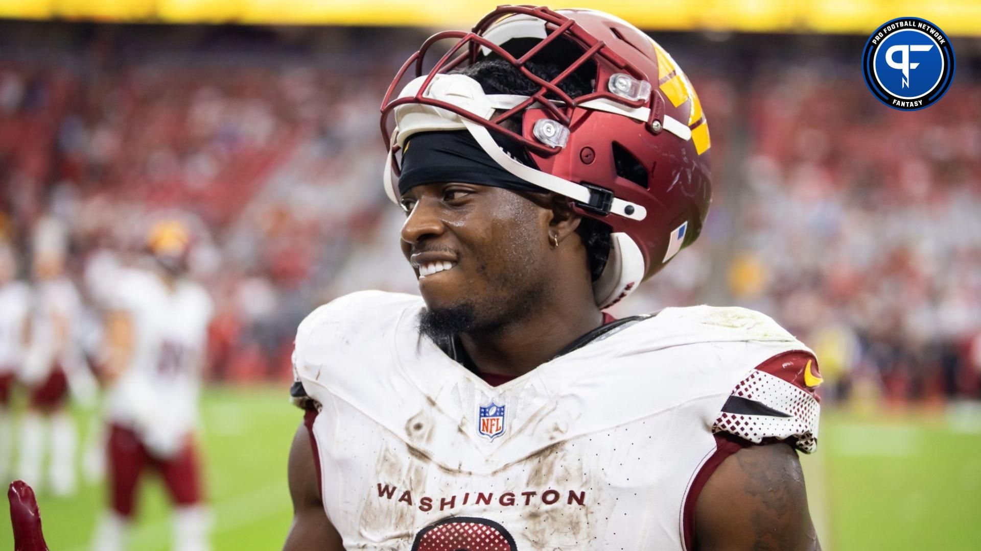 Washington Commanders running back Brian Robinson Jr. (8) against the Arizona Cardinals at State Farm Stadium.