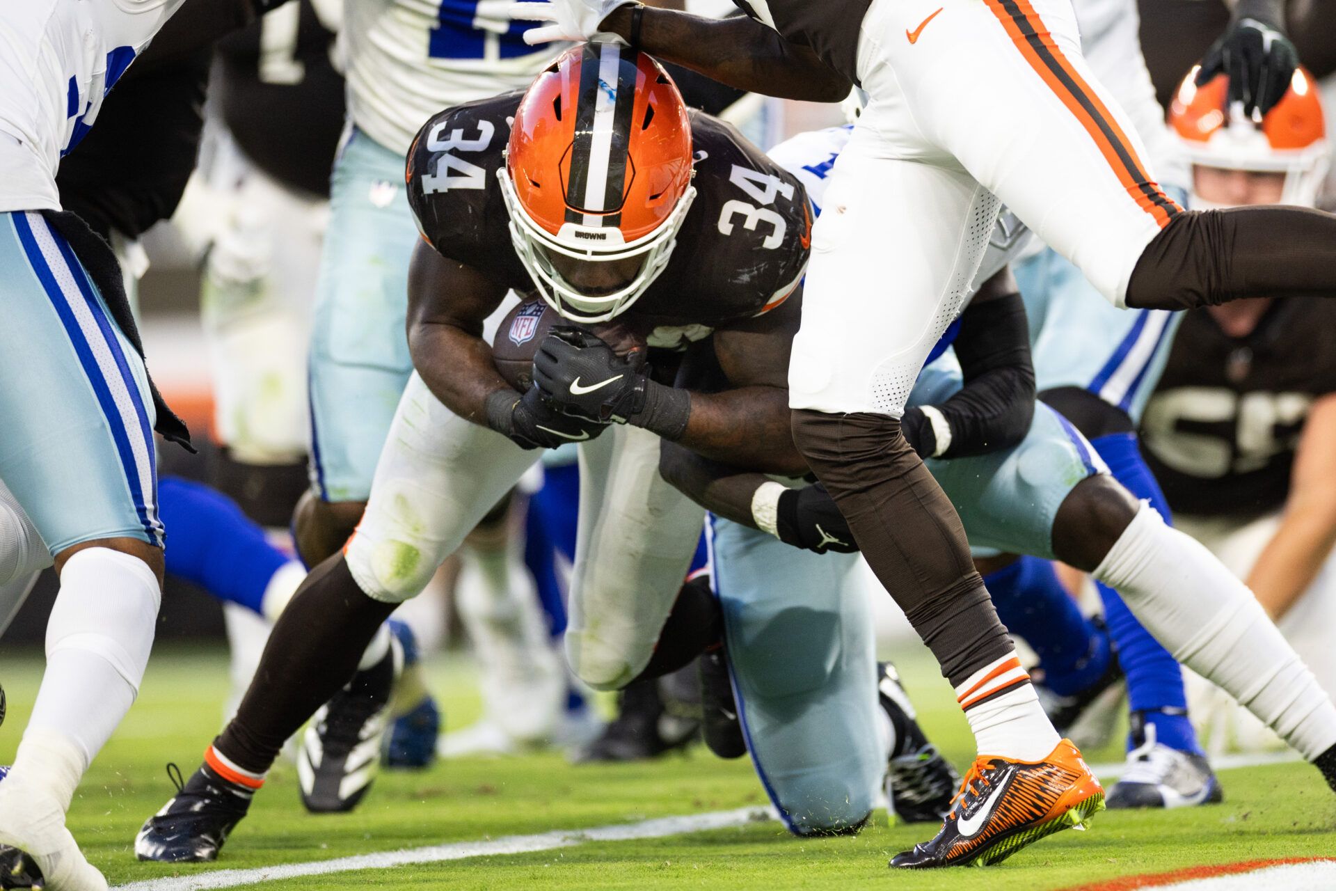 Sep 8, 2024; Cleveland, Ohio, USA; Cleveland Browns running back Jerome Ford (34) pushes into the end zone for a touchdown against the Dallas Cowboys during the fourth quarter at Huntington Bank Field. Mandatory Credit: Scott Galvin-Imagn Images