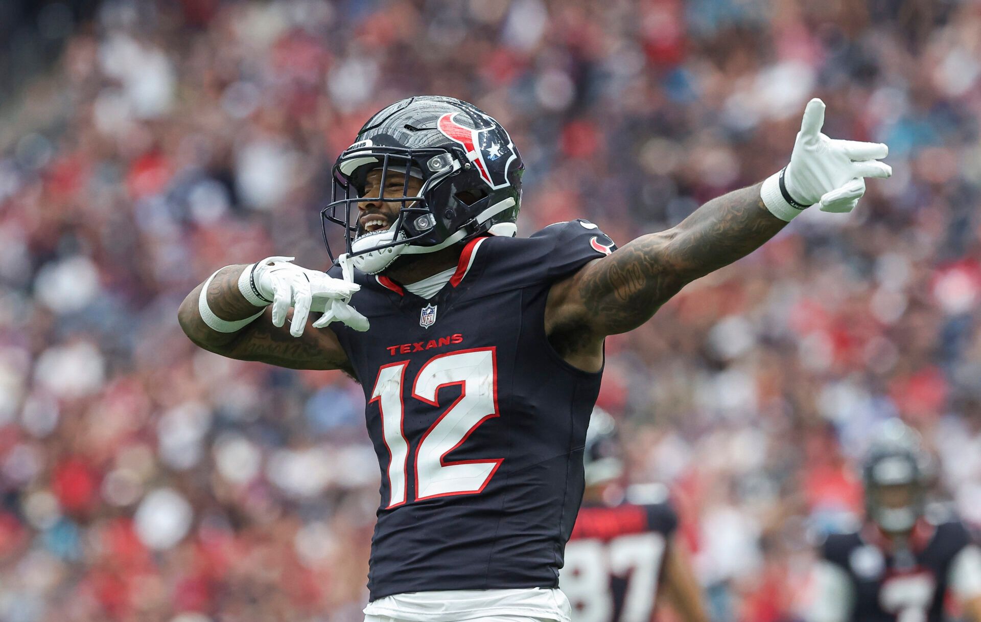 Sep 29, 2024; Houston, Texas, USA; Houston Texans wide receiver Nico Collins (12) signals after a first down during the first quarter against the Jacksonville Jaguars at NRG Stadium. Mandatory Credit: Troy Taormina-Imagn Images