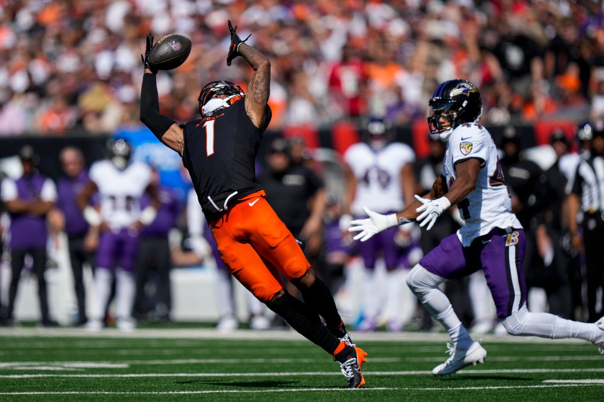 Cincinnati Bengals wide receiver Ja'Marr Chase (1) pulls in a catch in the first quarter of the NFL Week 5 game between the Cincinnati Bengals and Baltimore Ravens at Paycor Stadium in downtown Cincinnati on Sunday, Oct. 6, 2024. The Bengals led 17-14 at halftime.