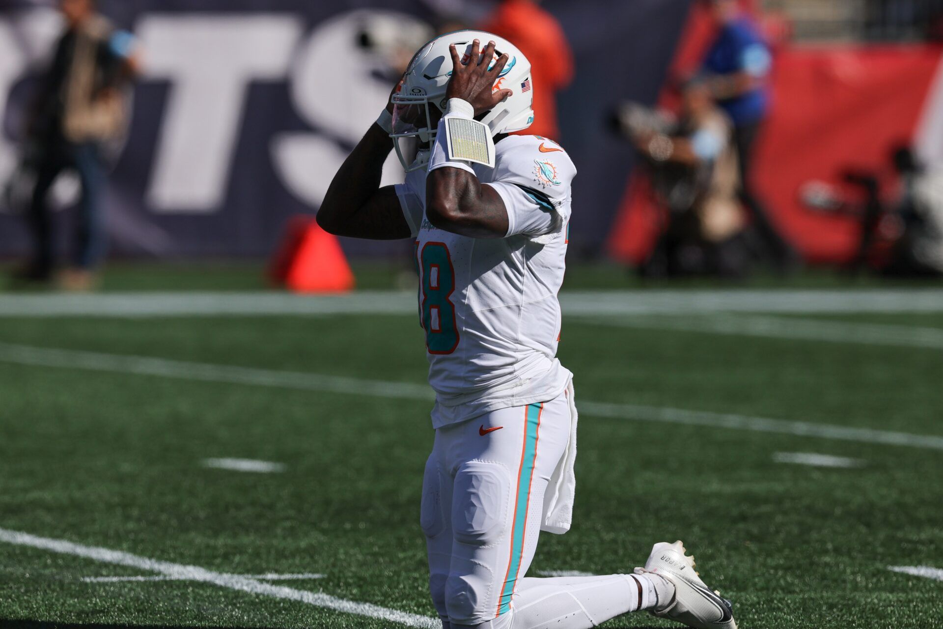 Miami Dolphins quarterback Tyler Huntley (18) reacts during the first half against the New England Patriots at Gillette Stadium.