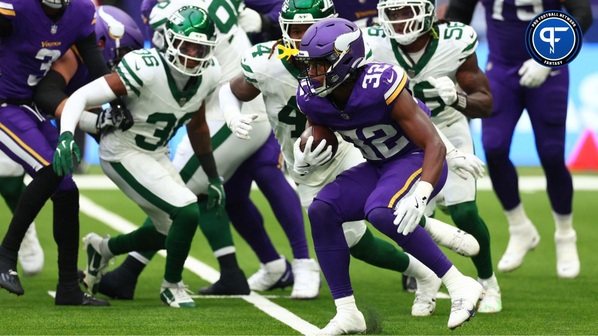 Minnesota Vikings Running Back Ty Chandler (32) runs a first down in the 2nd Quarter against New York Jets at Tottenham Hotspur Stadium. Should he be added off the fantasy football waiver wire?