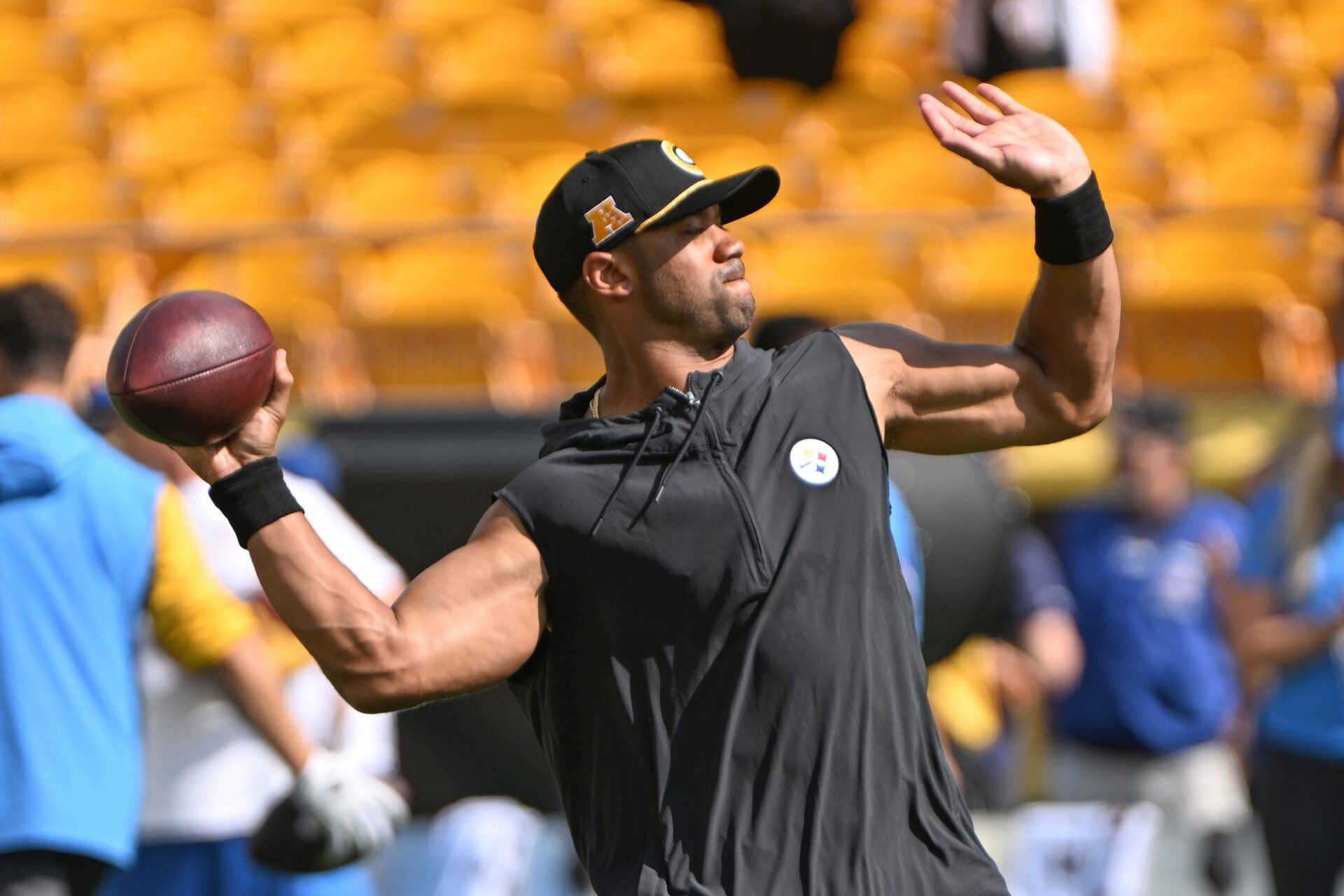 Pittsburgh Steelers quarterback Russell Wilson (3) works out before a game against the Los Angeles Chargers at Acrisure Stadium.