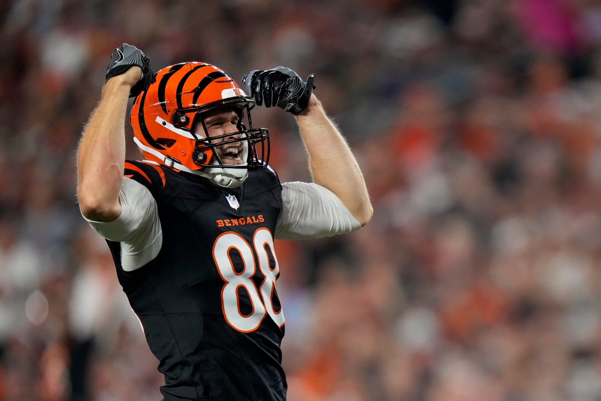 Cincinnati Bengals tight end Mike Gesicki (88) hypes up the crowd after a first down reception in the second quarter of the NFL Week 3 game between the Cincinnati Bengals and the Washington Commanders at Paycor Stadium in downtown Cincinnati on Monday, Sept. 23, 2024. The Commanders led 21-13 at halftime.