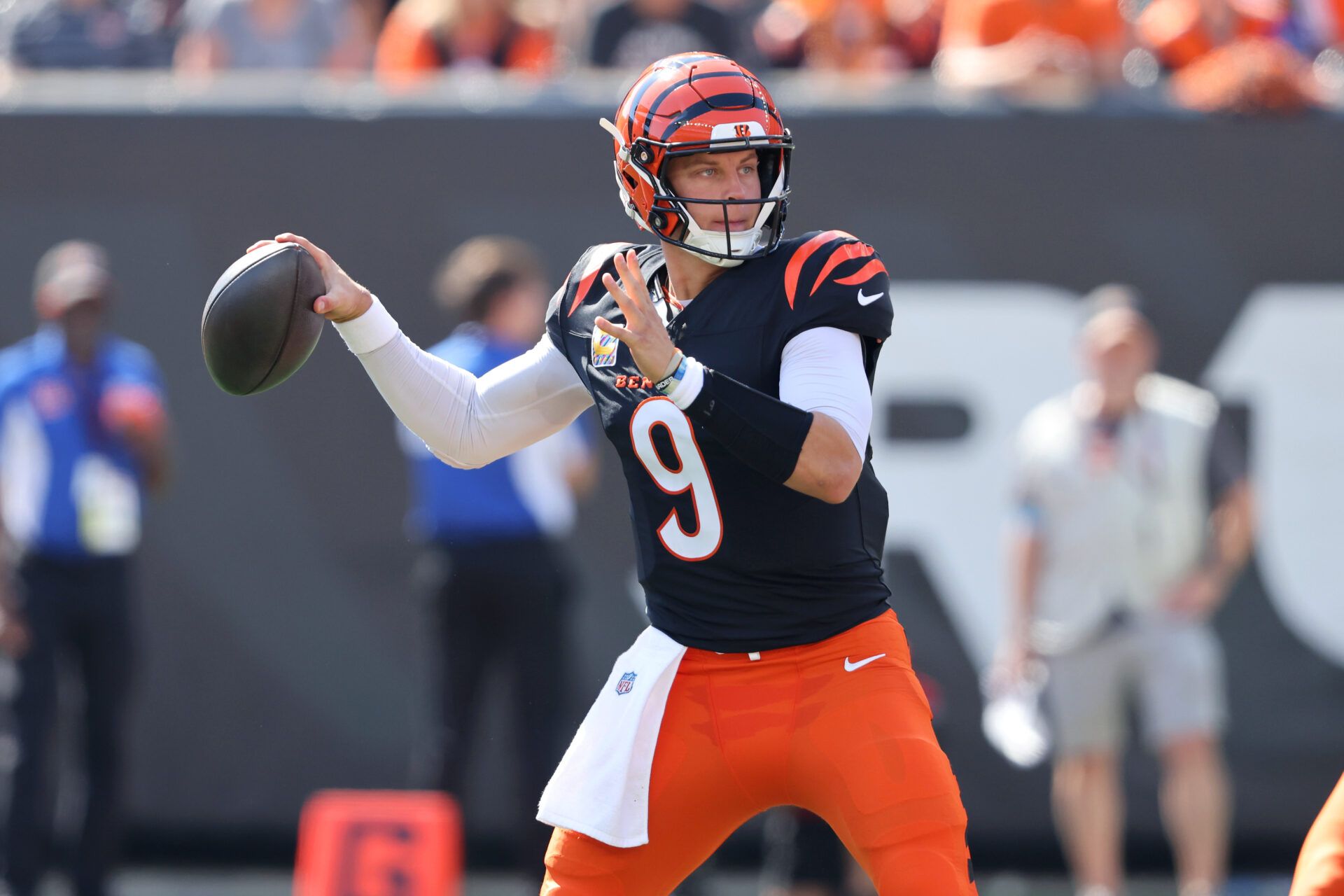 Oct 6, 2024; Cincinnati, Ohio, USA; Cincinnati Bengals quarterback Joe Burrow (9) drops to throw during the first quarter against the Baltimore Ravens at Paycor Stadium. Mandatory Credit: Joseph Maiorana-Imagn Images