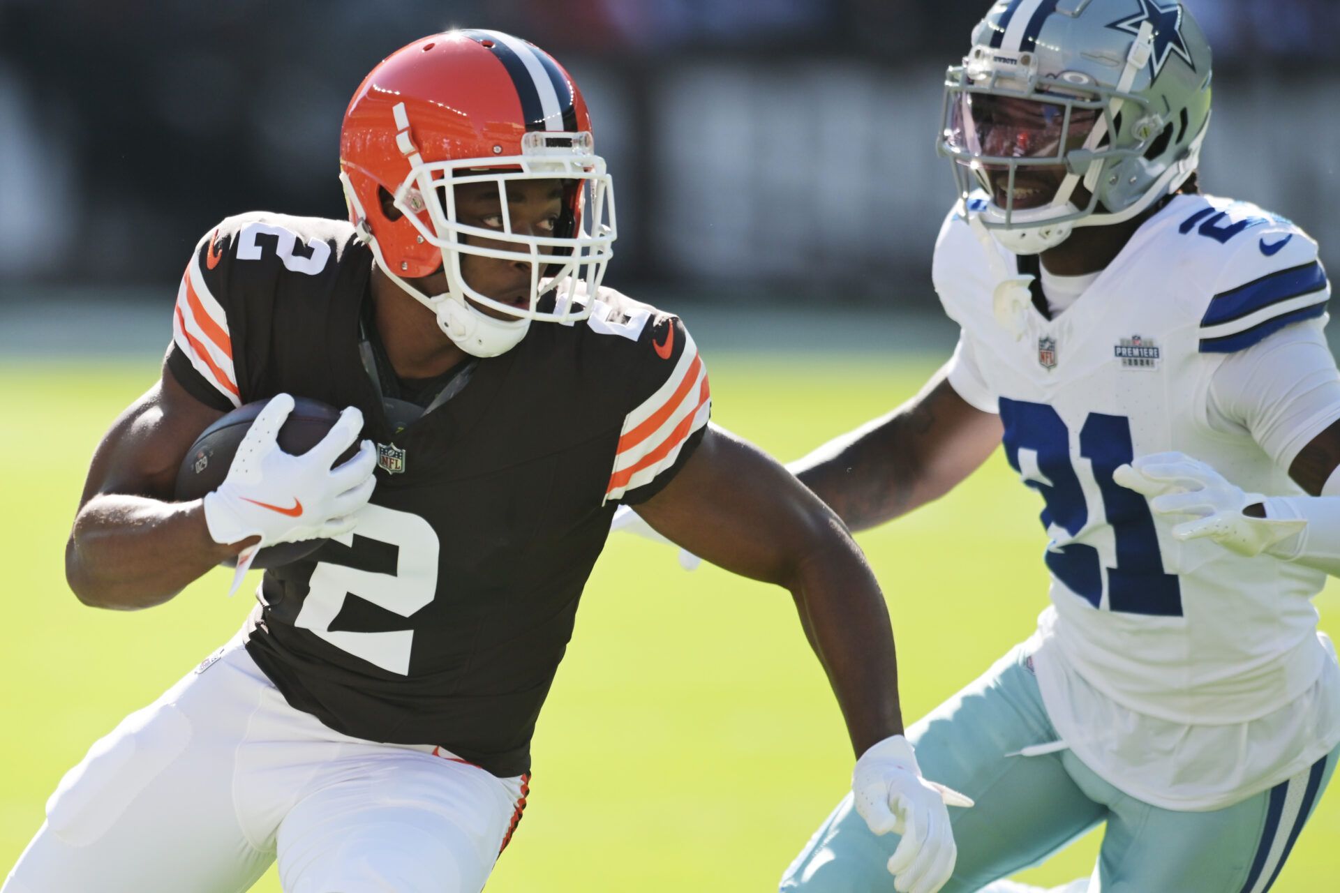 Sep 8, 2024; Cleveland, Ohio, USA; Cleveland Browns wide receiver Amari Cooper (2) runs with the ball after a catch as Dallas Cowboys cornerback Caelen Carson (21) defends during the first quarter at Huntington Bank Field. Mandatory Credit: Ken Blaze-Imagn Images