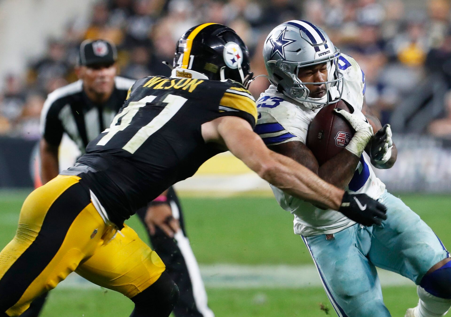 Oct 6, 2024; Pittsburgh, Pennsylvania, USA; Dallas Cowboys running back Rico Dowdle (23) runs the ball against Pittsburgh Steelers linebacker Payton Wilson (41) during the fourth quarter at Acrisure Stadium. Dallas won 20-17. Mandatory Credit: Charles LeClaire-Imagn Images