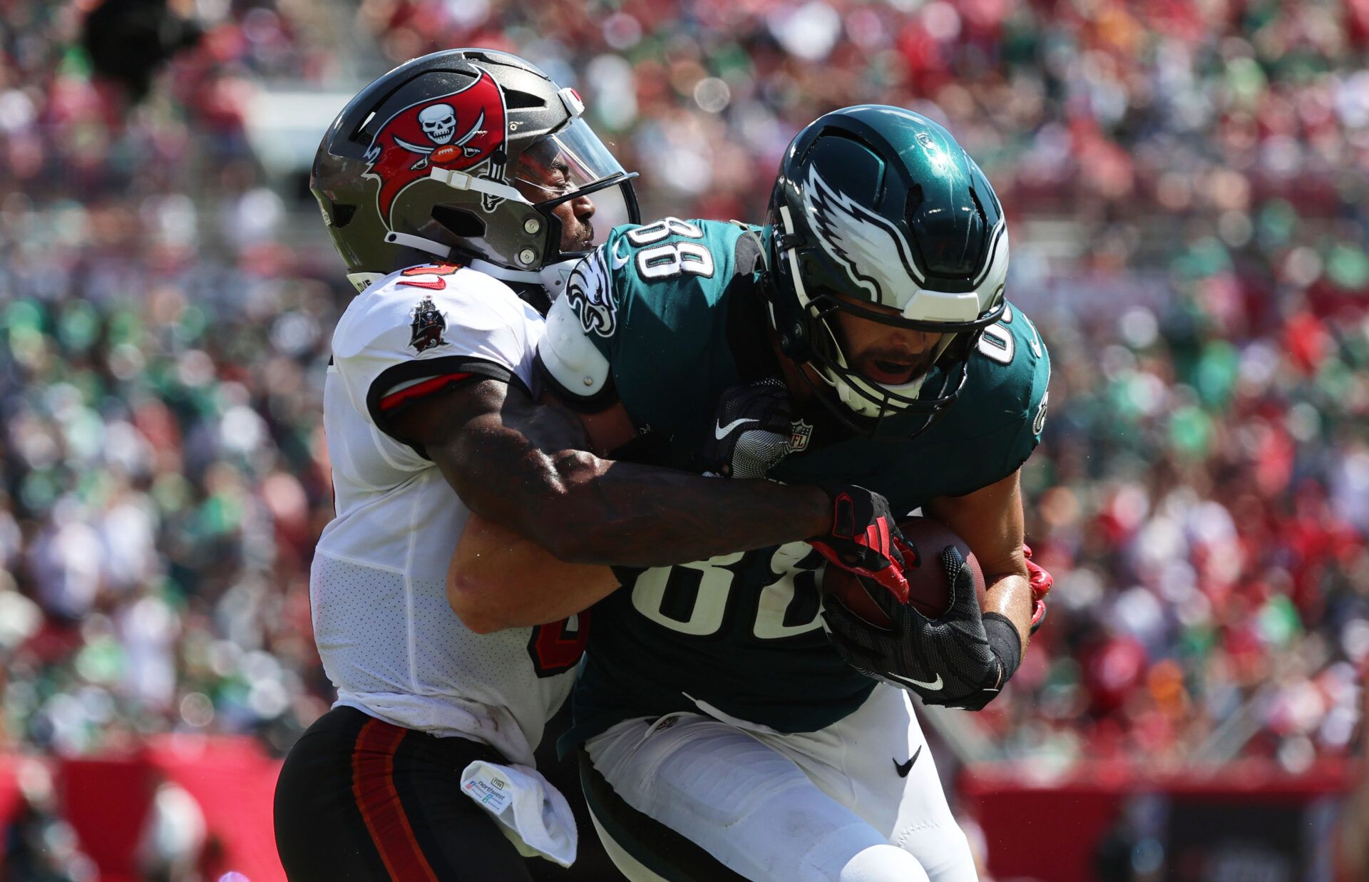 Sep 29, 2024; Tampa, Florida, USA; Philadelphia Eagles tight end Dallas Goedert (88) runs with the ball as Tampa Bay Buccaneers safety Jordan Whitehead (3) tackles during the first half at Raymond James Stadium. Mandatory Credit: Kim Klement Neitzel-Imagn Images