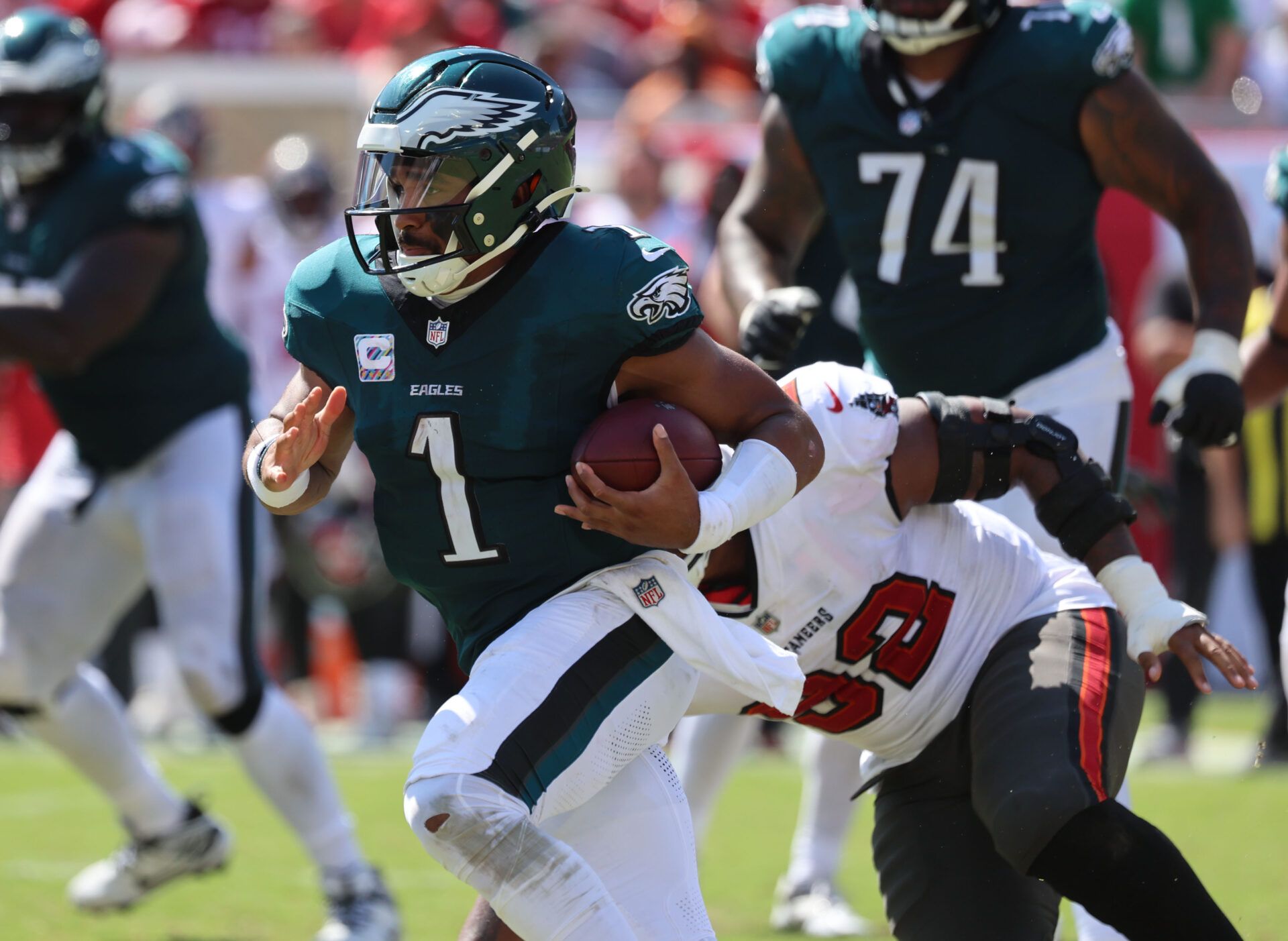 Sep 29, 2024; Tampa, Florida, USA; Philadelphia Eagles quarterback Jalen Hurts (1) runs with the ball against the Tampa Bay Buccaneers during the second half at Raymond James Stadium. Mandatory Credit: Kim Klement Neitzel-Imagn Images