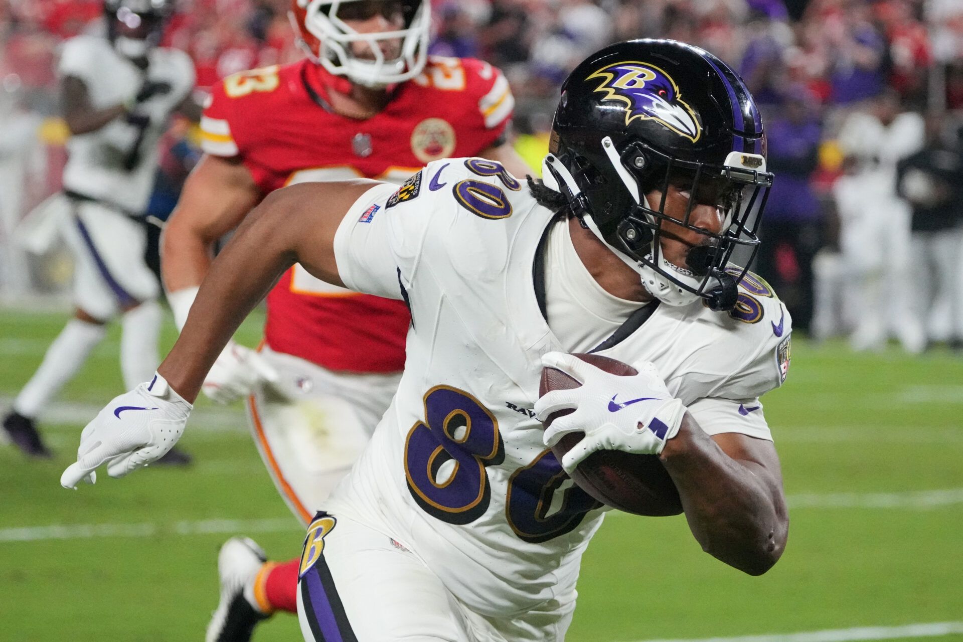 Sep 5, 2024; Kansas City, Missouri, USA; Baltimore Ravens tight end Isaiah Likely (80) runs the ball against the Kansas City Chiefs during the second half at GEHA Field at Arrowhead Stadium. Mandatory Credit: Denny Medley-Imagn Images