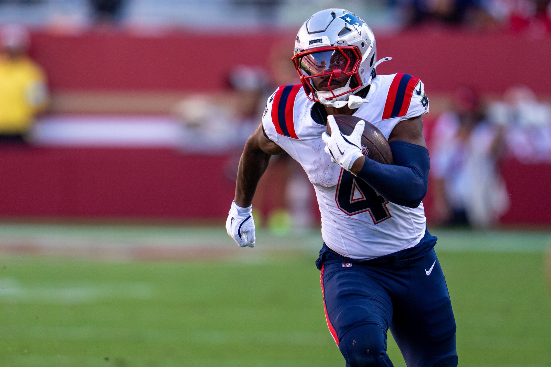 Sep 29, 2024; Santa Clara, California, USA; New England Patriots running back Antonio Gibson (4) runs for the first down against the San Francisco 49ers during the fourth quarter at Levi's Stadium. Mandatory Credit: Neville E. Guard-Imagn Images