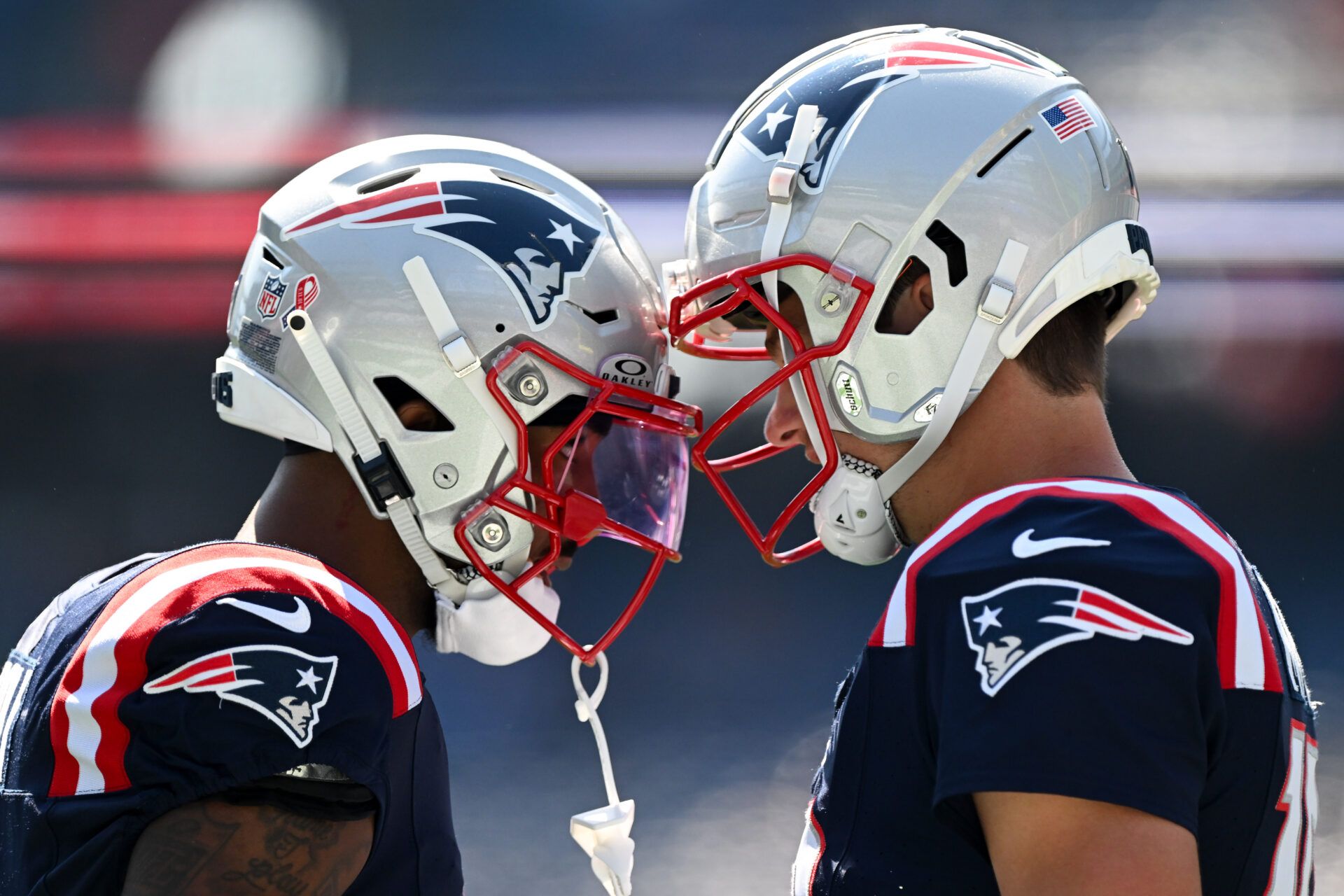 Sep 15, 2024; Foxborough, Massachusetts, USA; New England Patriots quarterback Drake Maye (10) and wide receiver Ja'Lynn Polk (1) talk before a game against the Seattle Seahawks at Gillette Stadium. Mandatory Credit: Brian Fluharty-Imagn Images