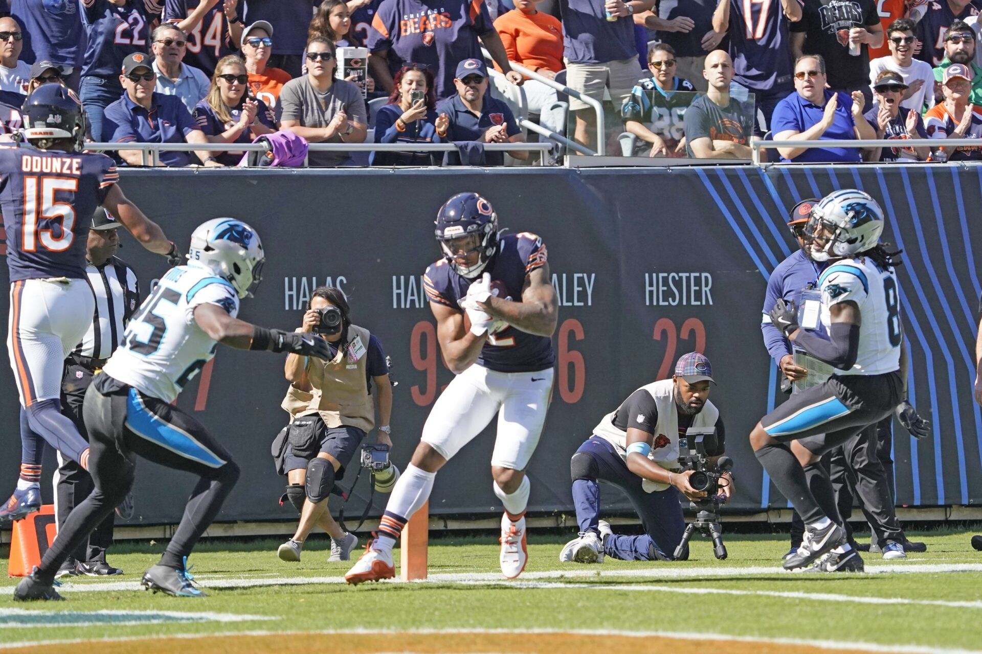 Oct 6, 2024; Chicago, Illinois, USA; Chicago Bears wide receiver DJ Moore (2) catches a touchdown pass as Carolina Panthers safety Xavier Woods (25) defends him during the first half at Soldier Field. Mandatory Credit: David Banks-Imagn Images