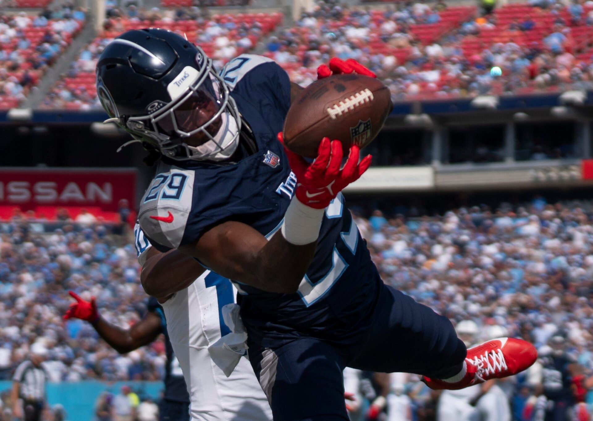 Tennessee Titans cornerback Jarvis Brownlee Jr. (29) comes up with a would-be interception against Indianapolis Colts wide receiver Adonai Mitchell (10) during their game at Nissan Stadium in Nashville, Tenn., Sunday, Oct. 13, 2024. The play was negated due to a defensive penalty.