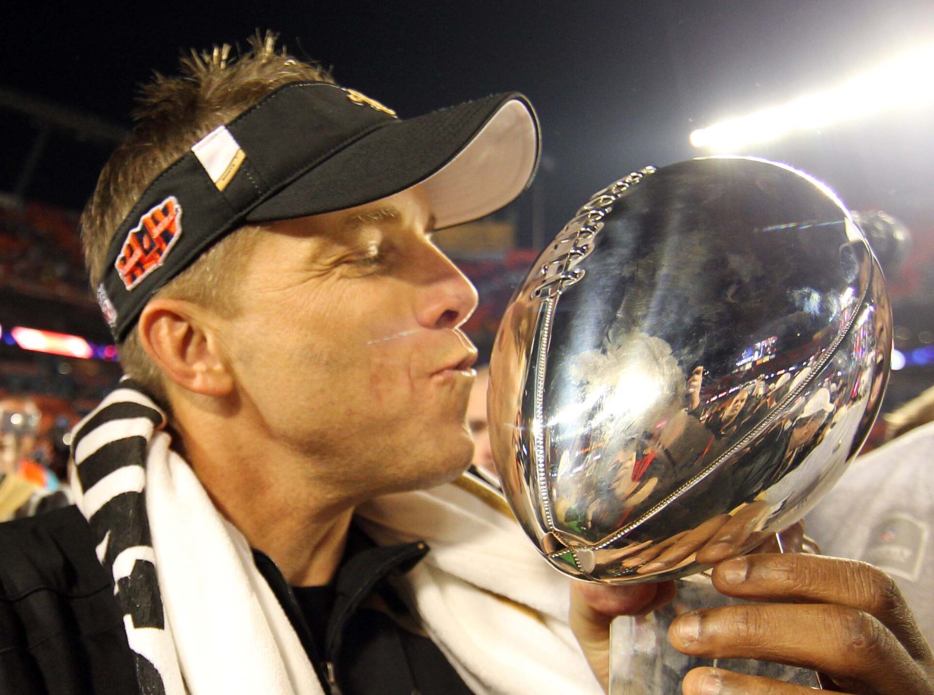 Feb 7, 2010; Miami, FL, USA; New Orleans Saints head coach Sean Payton kisses the Lombardi Trophy and celebrates after defeating the Indianapolis Colts 31-17 in Super Bowl XLIV at Sun Life Stadium. Mandatory Credit: Matthew Emmons-USA TODAY Sports