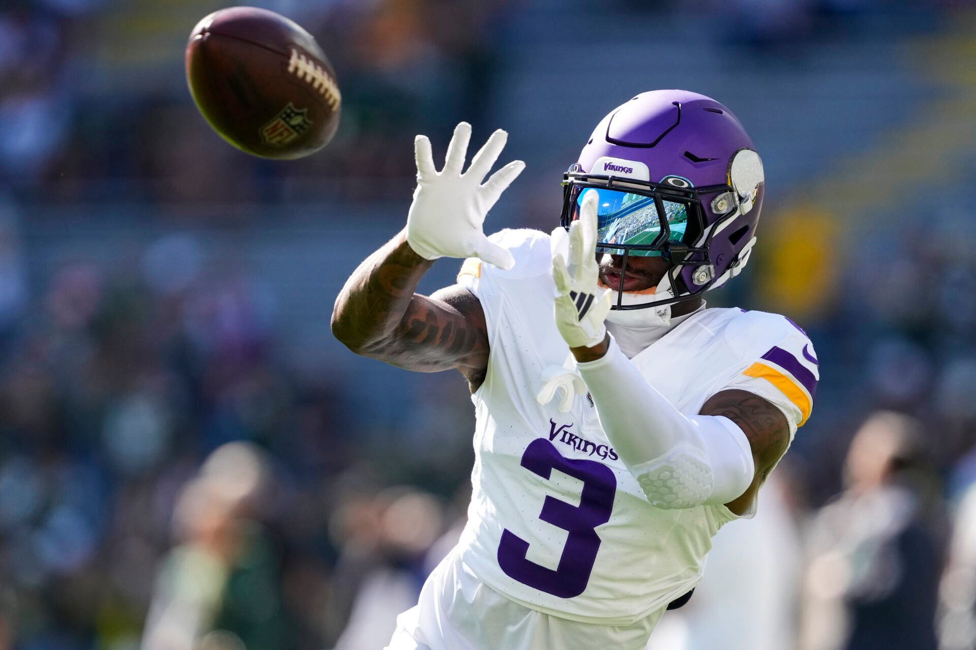 Sep 29, 2024; Green Bay, Wisconsin, USA; Minnesota Vikings wide receiver Jordan Addison (3) catches a pass during warmups prior to the game against the Green Bay Packers at Lambeau Field. Mandatory Credit: Jeff Hanisch-Imagn Images