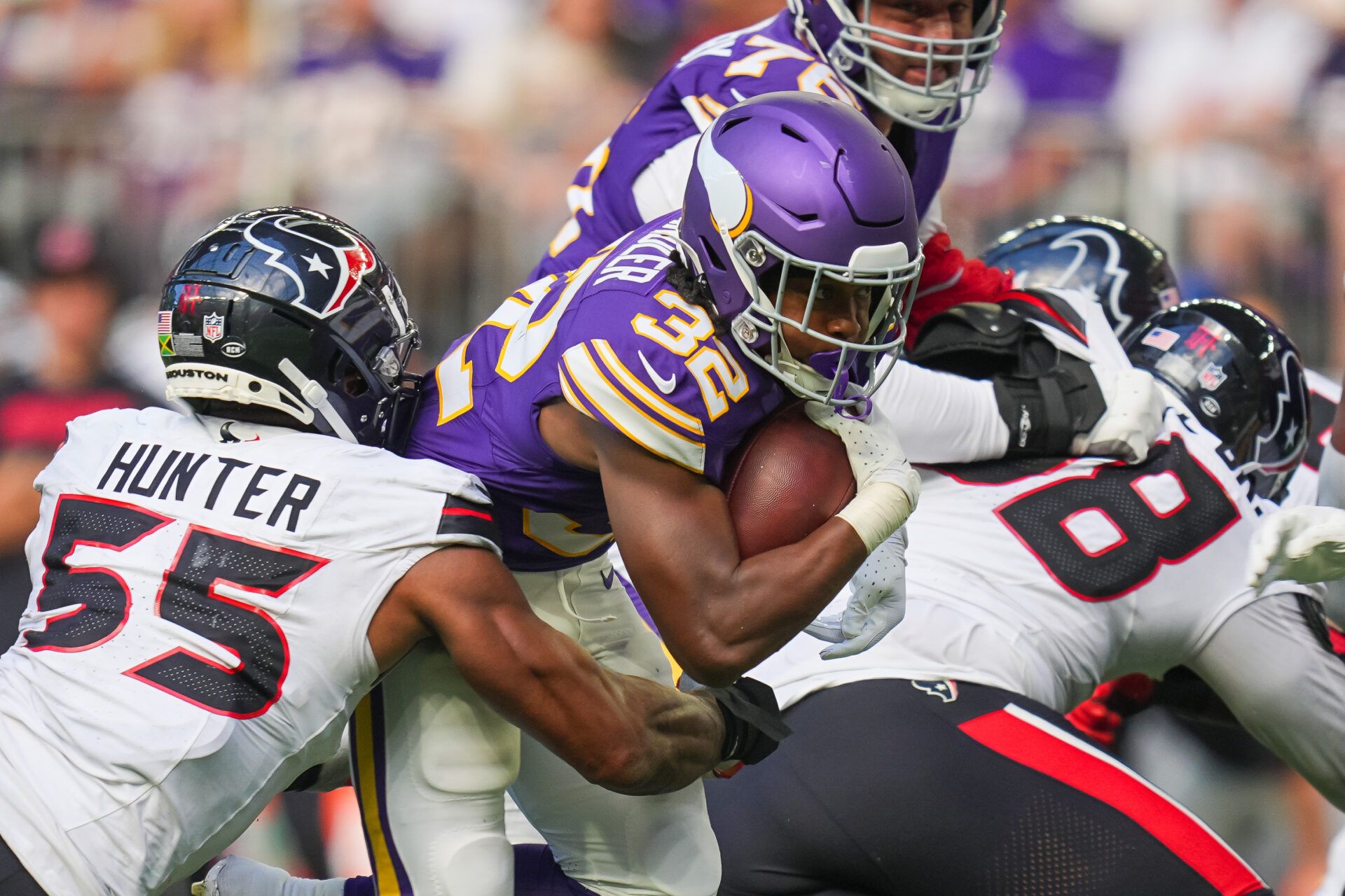 Sep 22, 2024; Minneapolis, Minnesota, USA; Minnesota Vikings running back Ty Chandler (32) runs with the ball against the Houston Texans in the third quarter at U.S. Bank Stadium. Mandatory Credit: Brad Rempel-Imagn Images