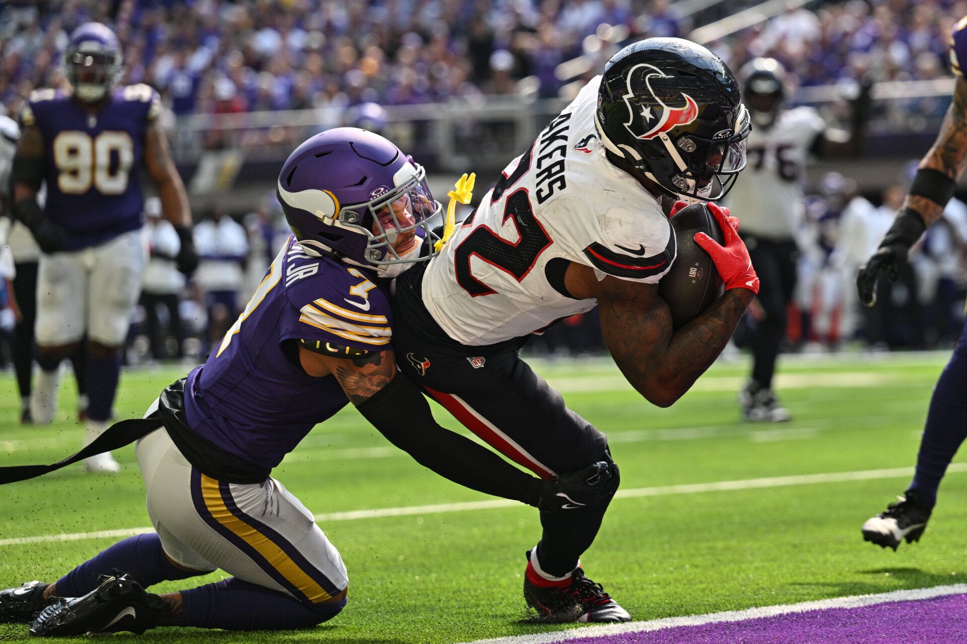 Sep 22, 2024; Minneapolis, Minnesota, USA; Houston Texans running back Cam Akers (22) runs for a touchdown as Minnesota Vikings cornerback Byron Murphy Jr. (7) attempts to make the tackle during the third quarter at U.S. Bank Stadium. Mandatory Credit: Jeffrey Becker-Imagn Images