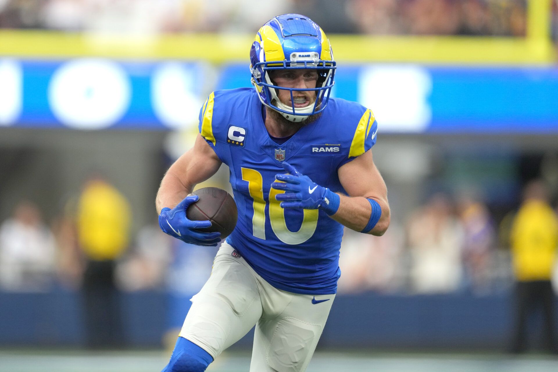 Dec 17, 2023; Inglewood, California, USA; Los Angeles Rams wide receiver Cooper Kupp (10) carries the ball against the Washington Commanders in the first half at SoFi Stadium. Mandatory Credit: Kirby Lee-USA TODAY Sports