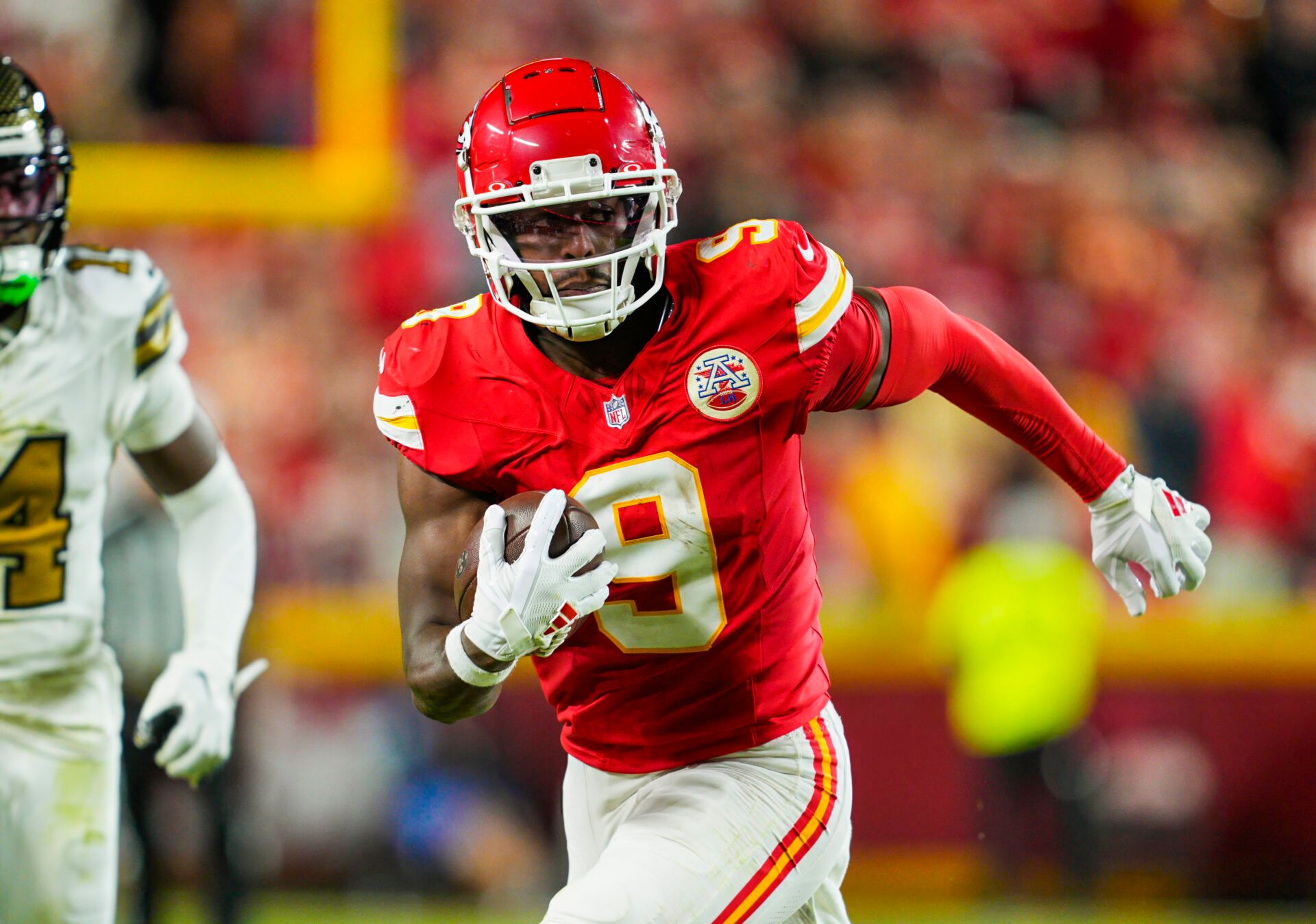 Kansas City Chiefs wide receiver JuJu Smith-Schuster (9) runs with the ball during the first half against the New Orleans Saints at GEHA Field at Arrowhead Stadium.