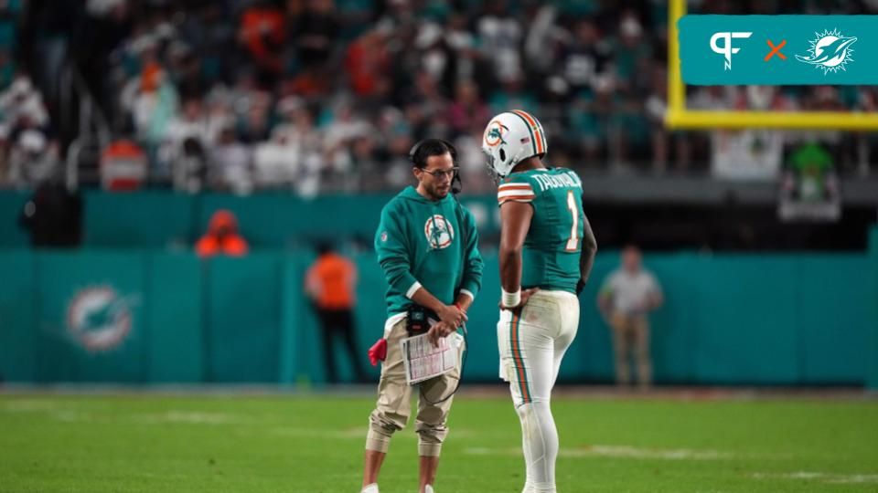 Miami Dolphins head coach Mike McDaniel talks with quarterback Tua Tagovailoa (1) during a timeout in the second half against the Dallas Cowboys at Hard Rock Stadium.