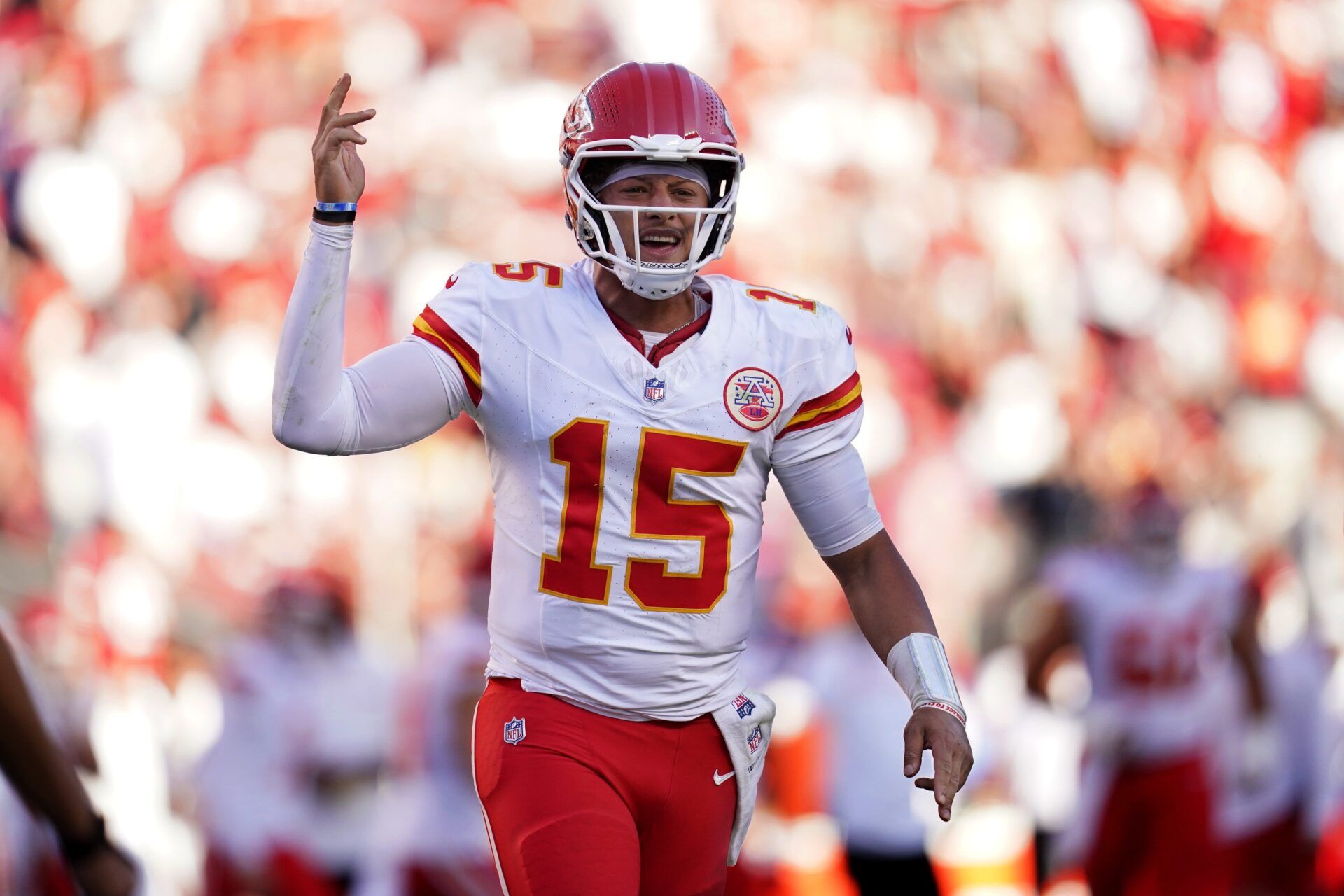 Kansas City Chiefs quarterback Patrick Mahomes (15) reacts after the Chiefs scored a touchdown against the San Francisco 49ers in the fourth quarter at Levi's Stadium.
