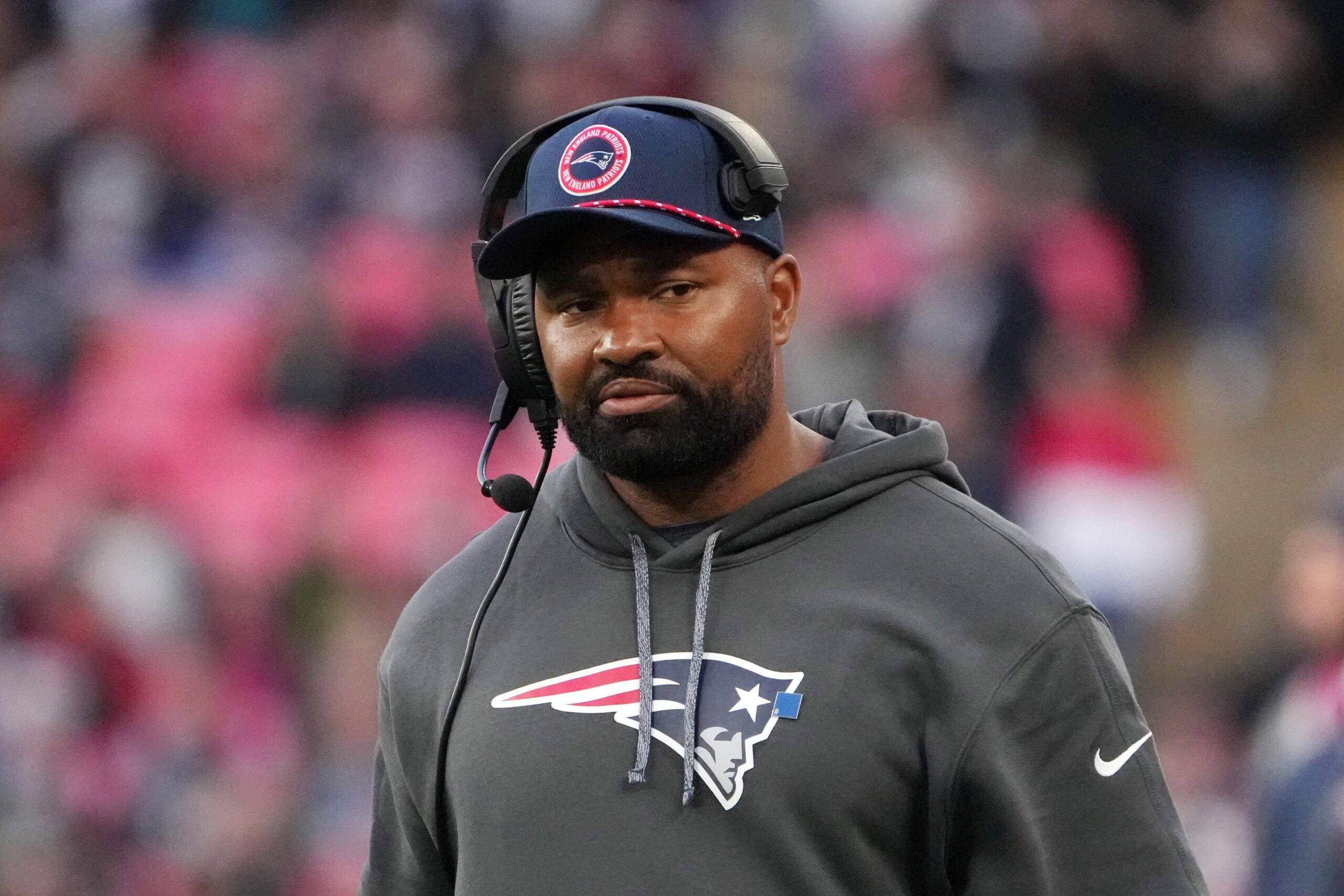 New England Patriots coach Jerod Mayo watches from the sidelines against the New England Patriots in the second half of an NFL International Series game at Wembley Stadium.