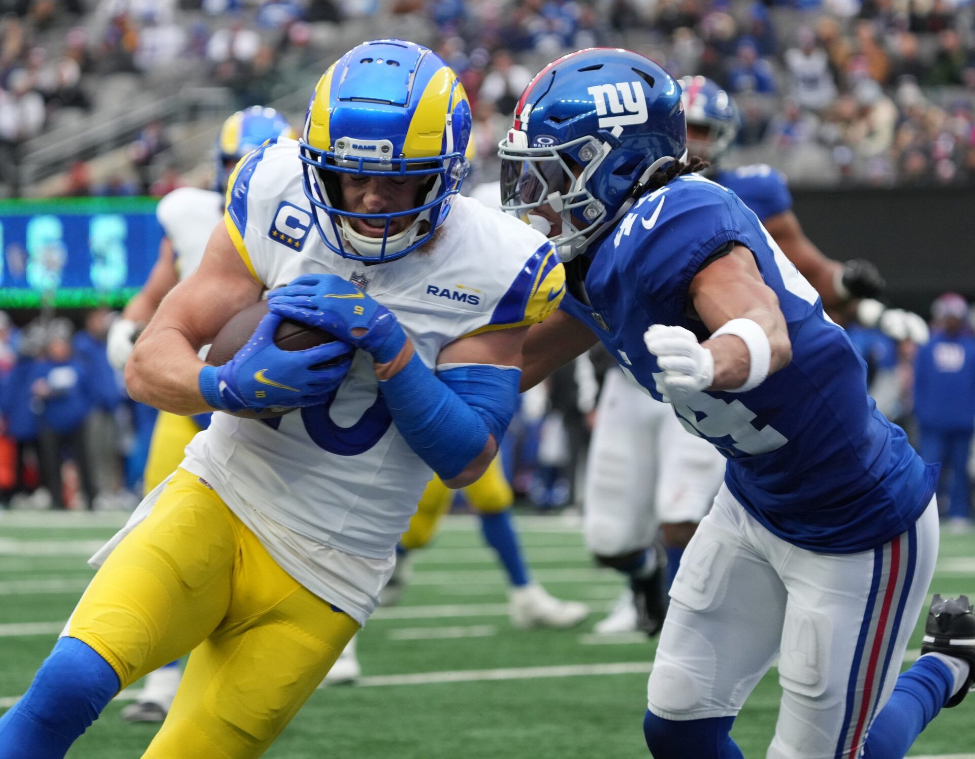 East Rutherford, NJ — December 31, 2023 -- Cooper Kupp of the Rams scoring a TD as he can’t be stopped by Nick McCloud of the Giants in the first half. The New York Giants host the Los Angeles Rams on December 31, 2023 at at MetLife Stadium in East Rutherford, NJ.