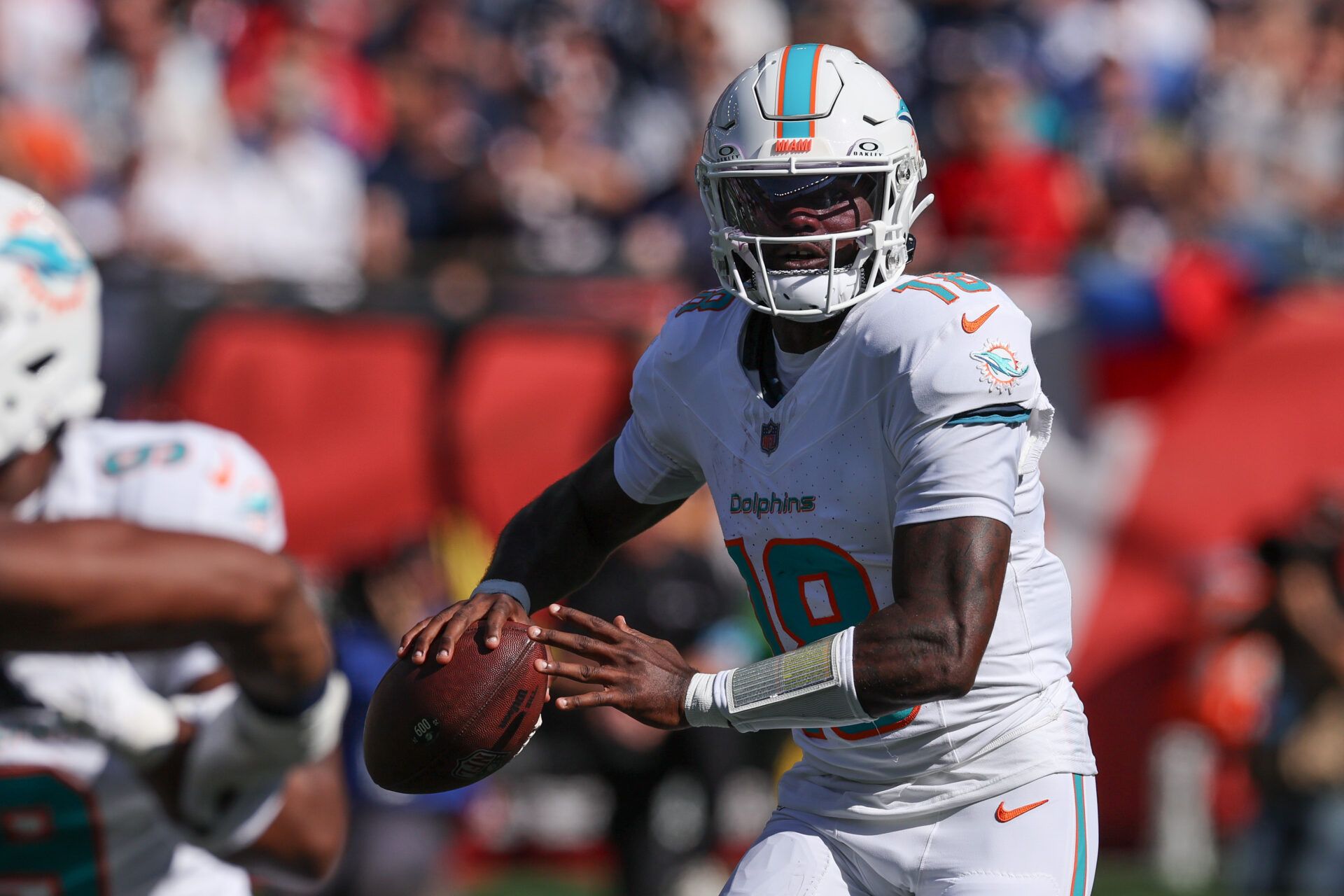 Oct 6, 2024; Foxborough, Massachusetts, USA; Miami Dolphins quarterback Tyler Huntley (18) throws the ball during the first half against the New England Patriots at Gillette Stadium. Mandatory Credit: Paul Rutherford-Imagn Images