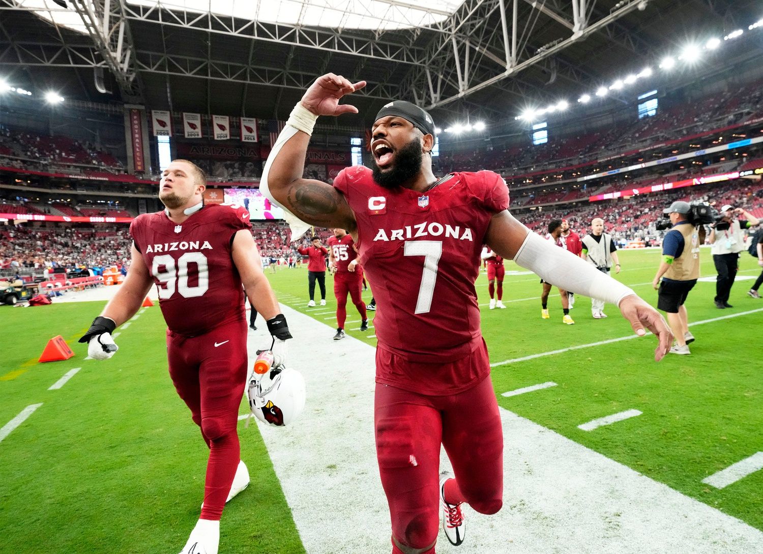 Arizona Cardinals linebacker Kyzir White (7) celebrates their 28-16 win over the Dallas Cowboys at State Farm Stadium in Glendale on Sept. 24, 2023.