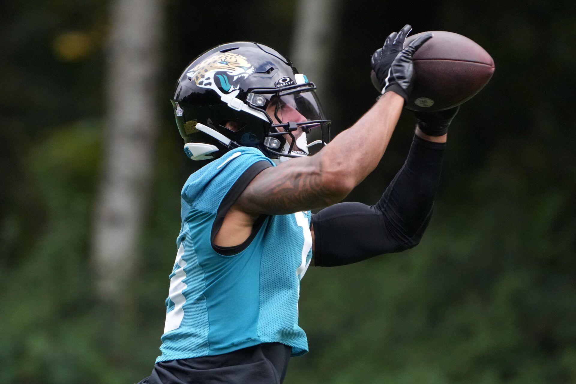 Oct 16, 2024; Watford, United Kingdom; Jacksonville Jaguars wide receiver Christian Kirk (13) catches the ball during practice at The Grove. Mandatory Credit: Kirby Lee-Imagn Images