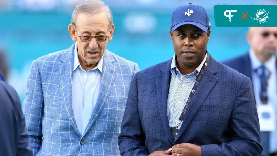 Dolphins owner Stephen Ross (left) talks with general manager Chris Grier before a game in November 2022.