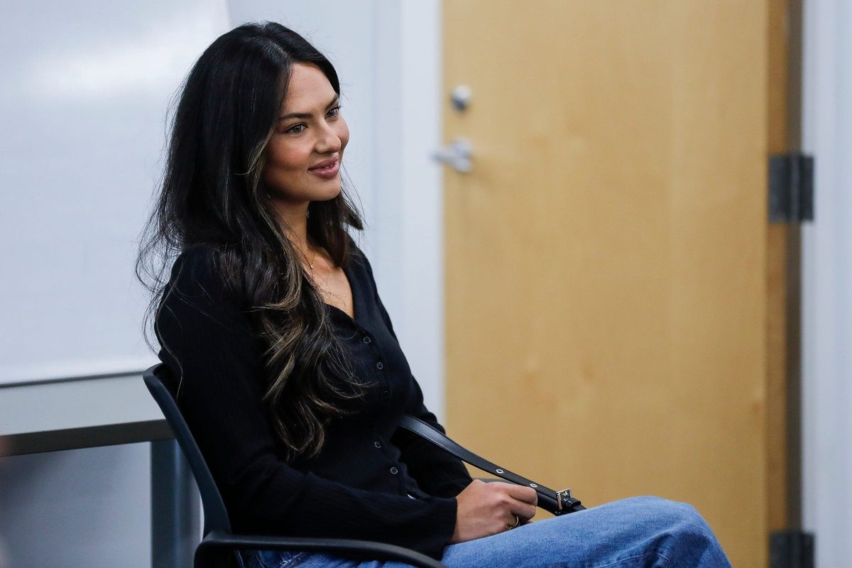 Detroit Lions quarterback Jared Goff's fiancee Christen Harper listens as Goff speaks at Detroit Lions headquarters and training facility in Allen Park on Thursday, May 16, 2024.