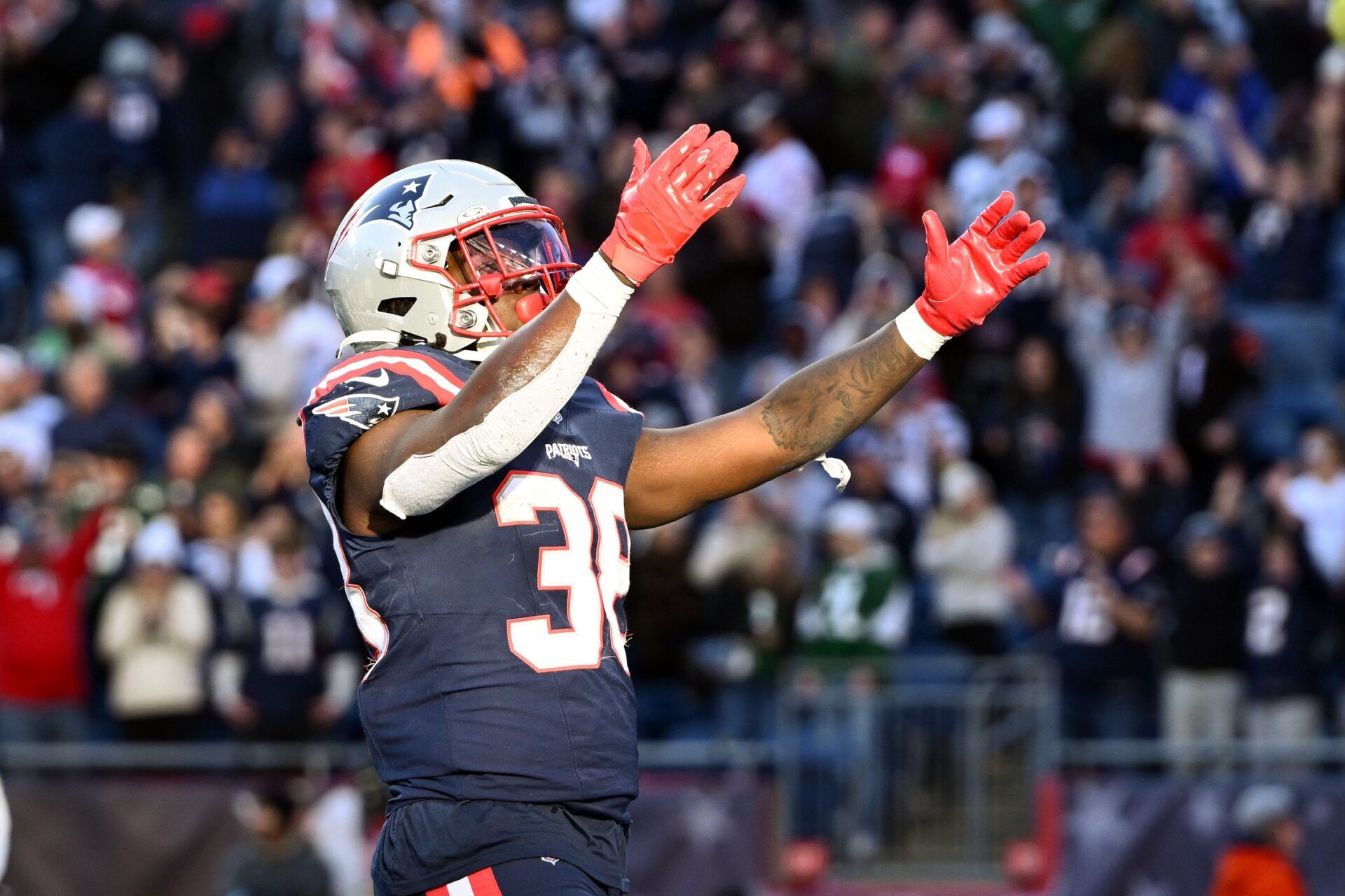Oct 27, 2024; Foxborough, Massachusetts, USA; New England Patriots running back Rhamondre Stevenson (38) reacts after scoring a touchdown against the New York Jets during the second half at Gillette Stadium. Mandatory Credit: Brian Fluharty-Imagn Images