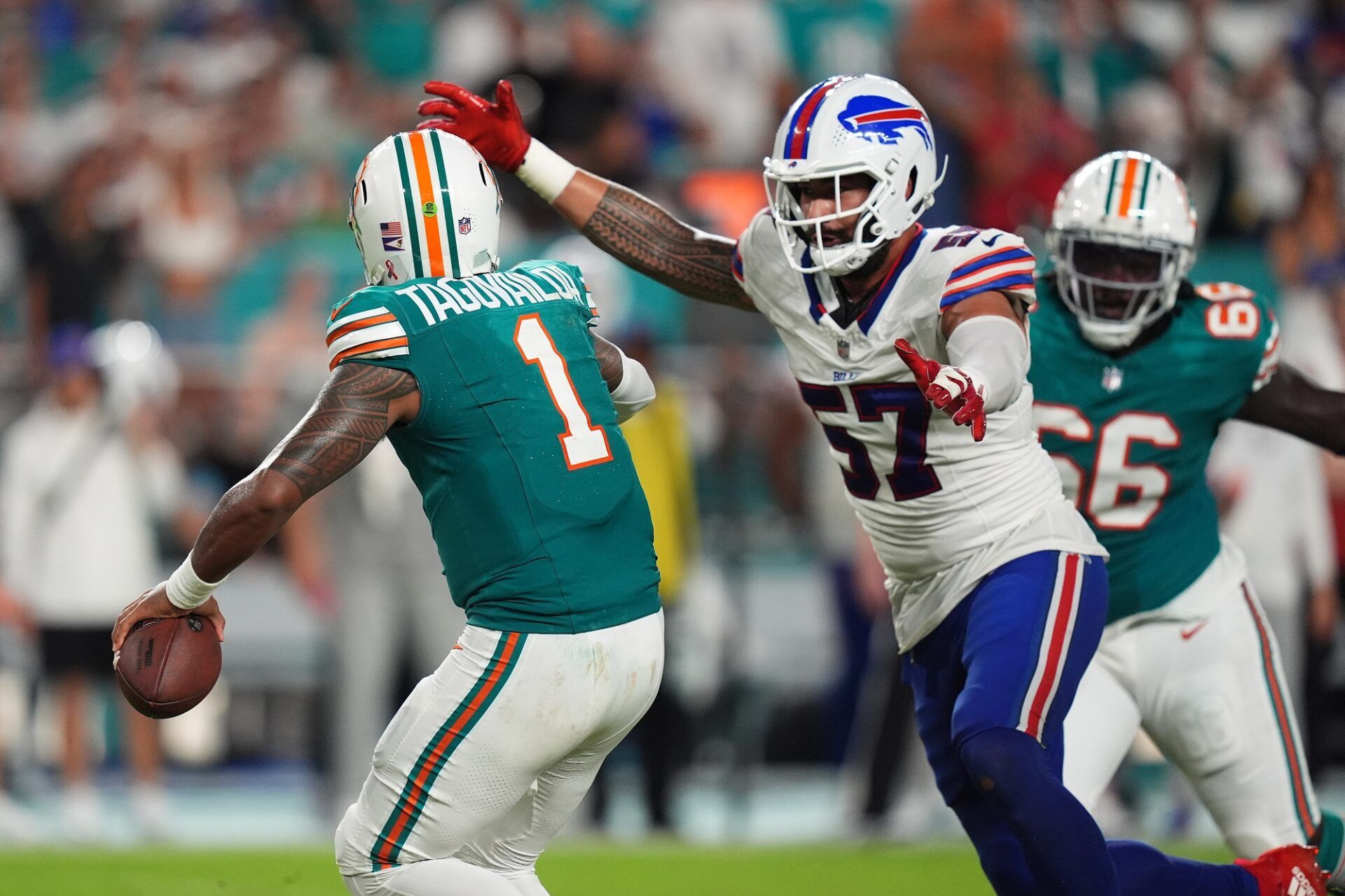 Buffalo Bills defensive end AJ Epenesa (57) pressures Miami Dolphins quarterback Tua Tagovailoa (1) during the second half at Hard Rock Stadium.