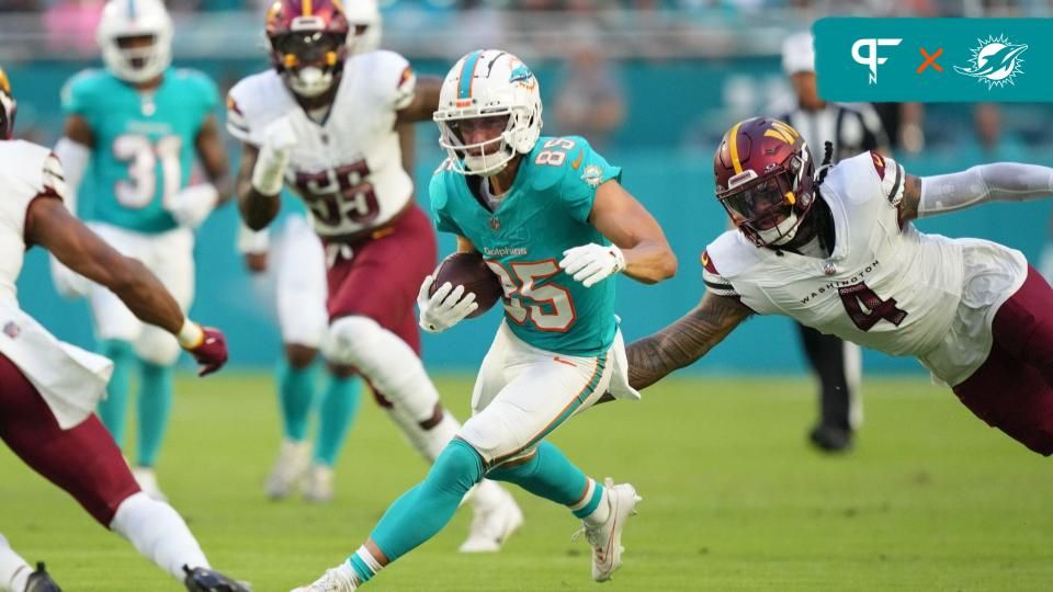 Miami Dolphins wide receiver River Cracraft (85) runs against Washington Commanders linebacker Frankie Luvu (4) during the first quarter at Hard Rock Stadium.