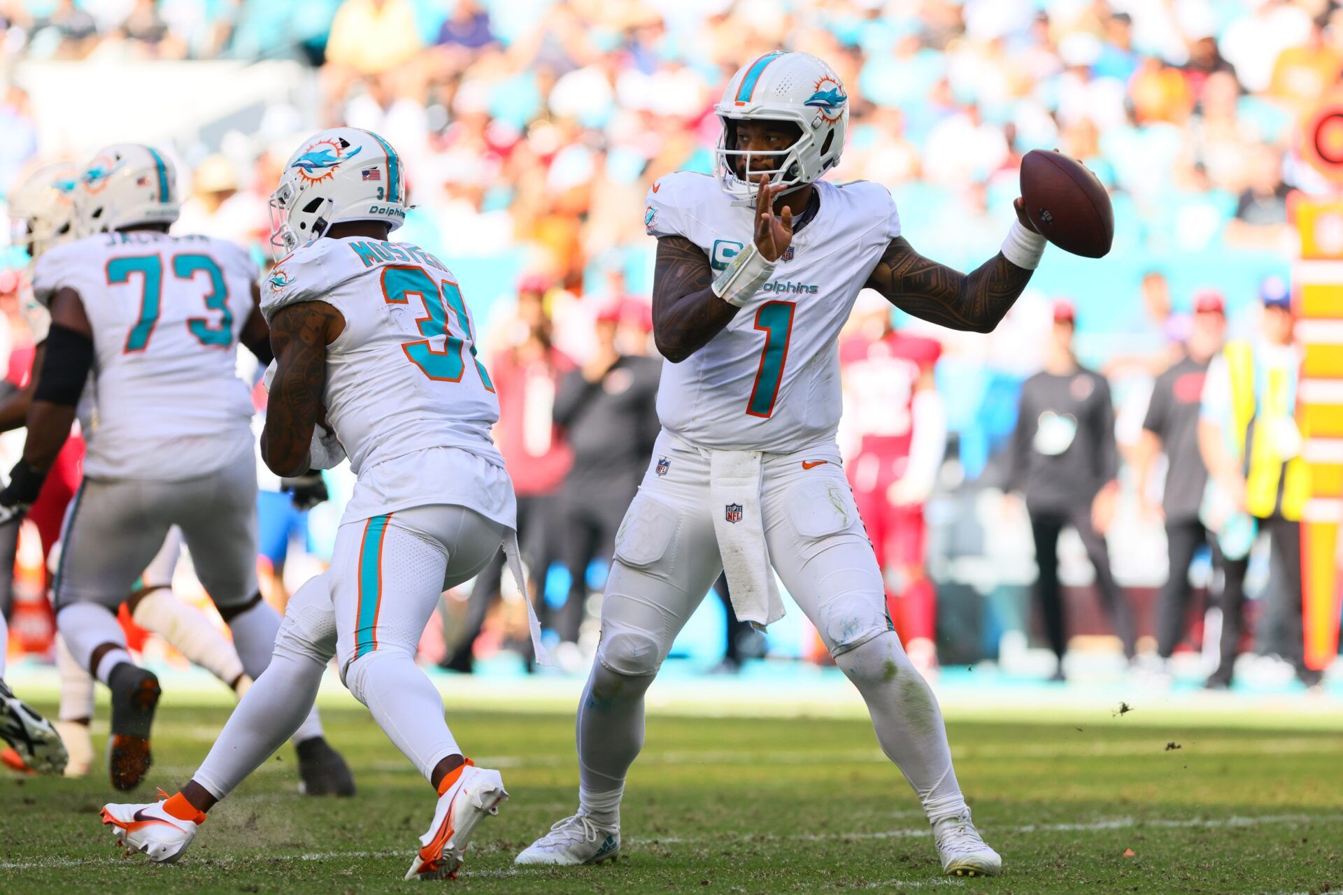 Miami Dolphins quarterback Tua Tagovailoa (1) throws the football against the Arizona Cardinals during the third quarter at Hard Rock Stadium.