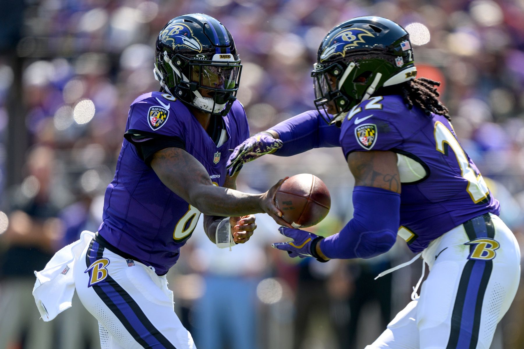 Baltimore Ravens quarterback Lamar Jackson (8) hands off to running back Derrick Henry (22) during the first half against the Las Vegas Raiders at M&T Bank Stadium.