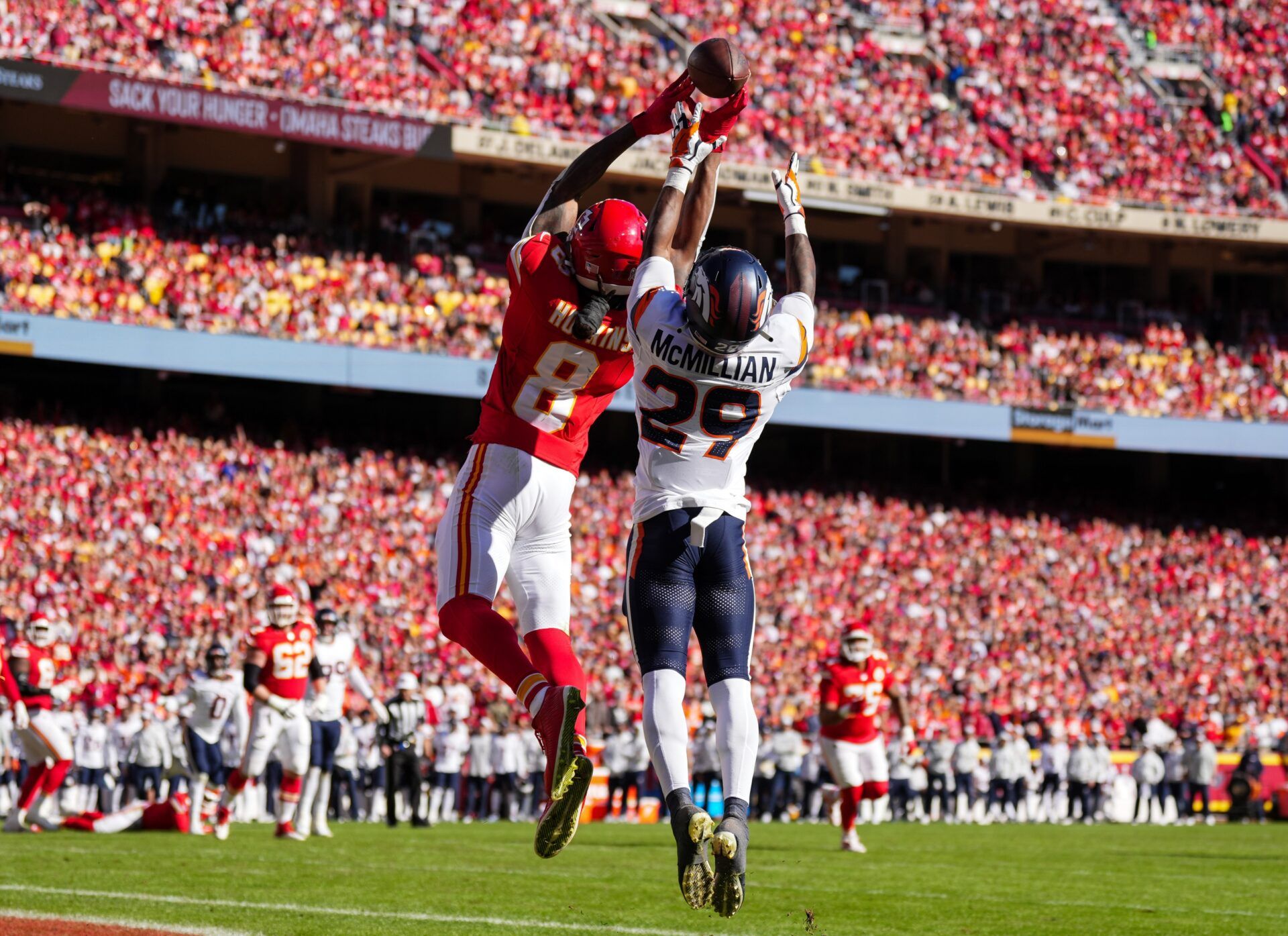 Kansas City Chiefs wide receiver DeAndre Hopkins (8) is unable to make a catch against Denver Broncos cornerback Ja'Quan McMillian (29) during the first half at GEHA Field at Arrowhead Stadium.